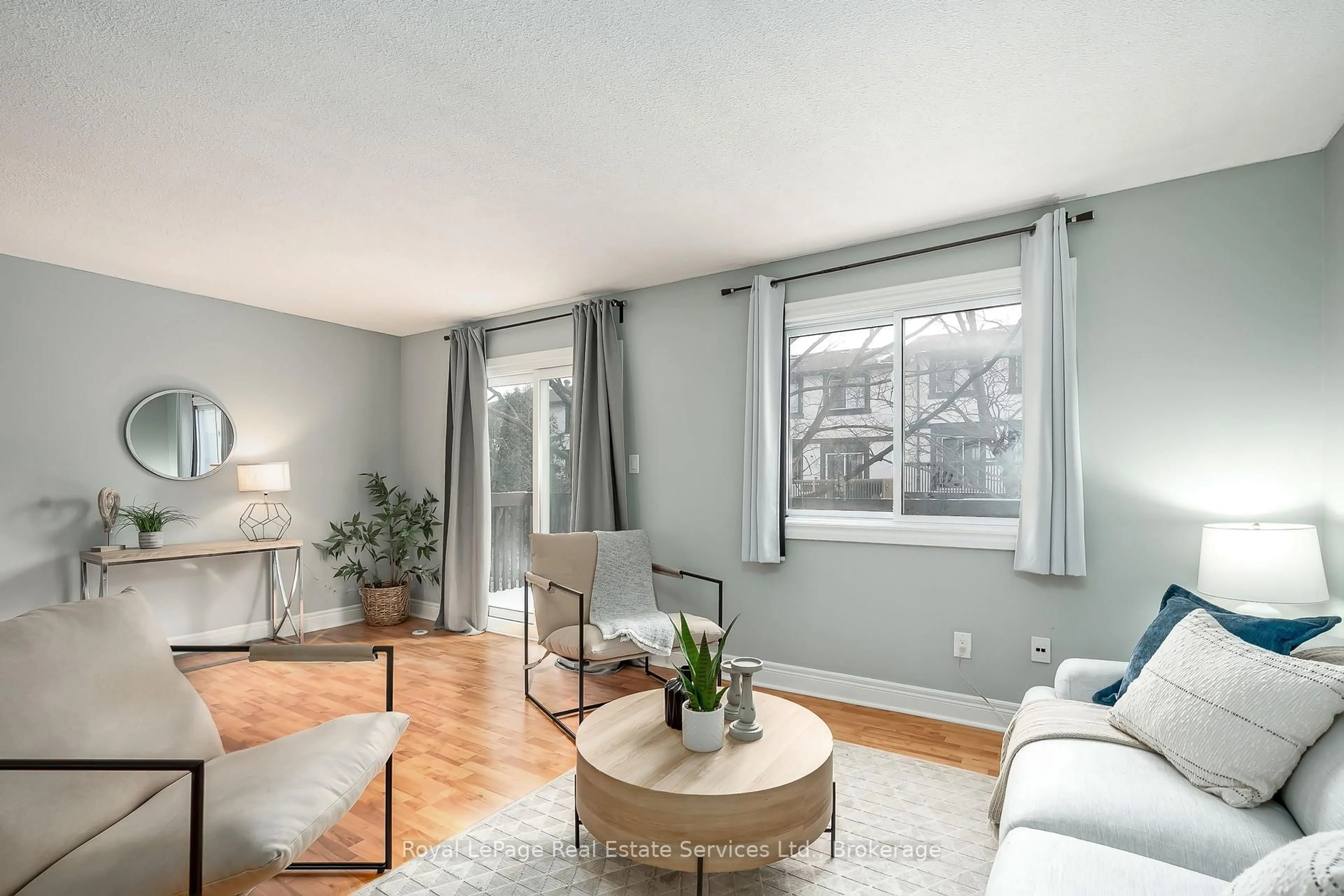 Living room with furniture, wood/laminate floor for 2651 Aquitaine Ave #24, Mississauga Ontario L5N 1V5