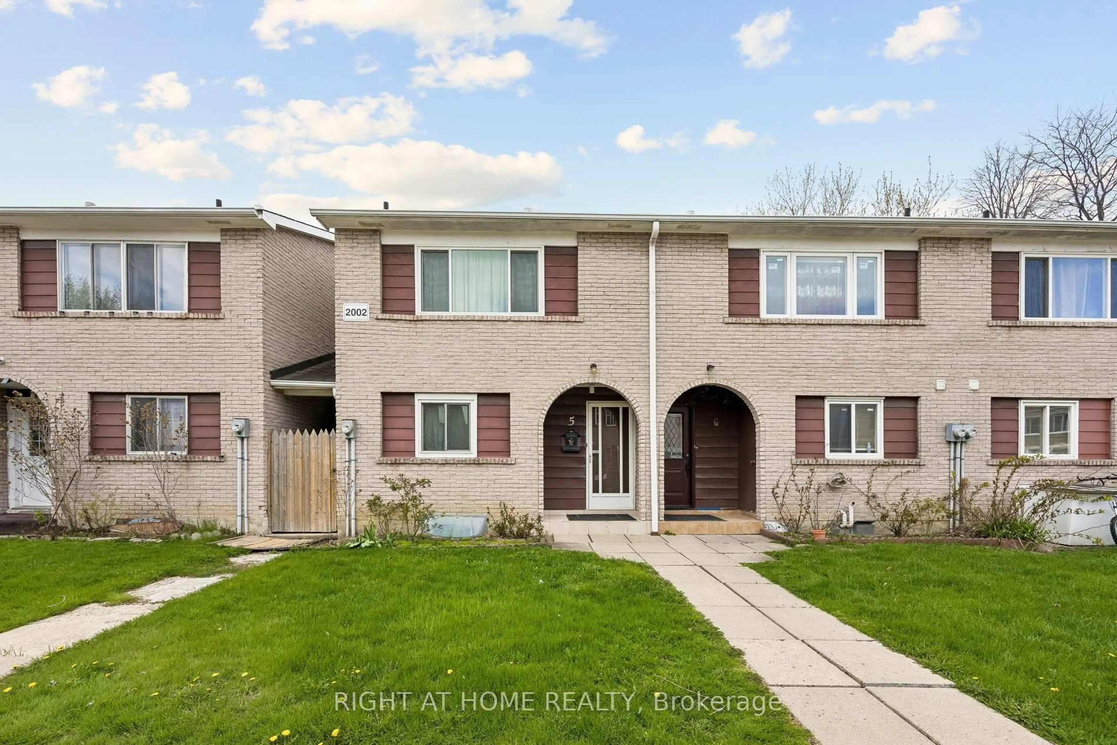 Home with brick exterior material, street for 2002 Martin Grove Rd #5, Toronto Ontario M9V 4A3