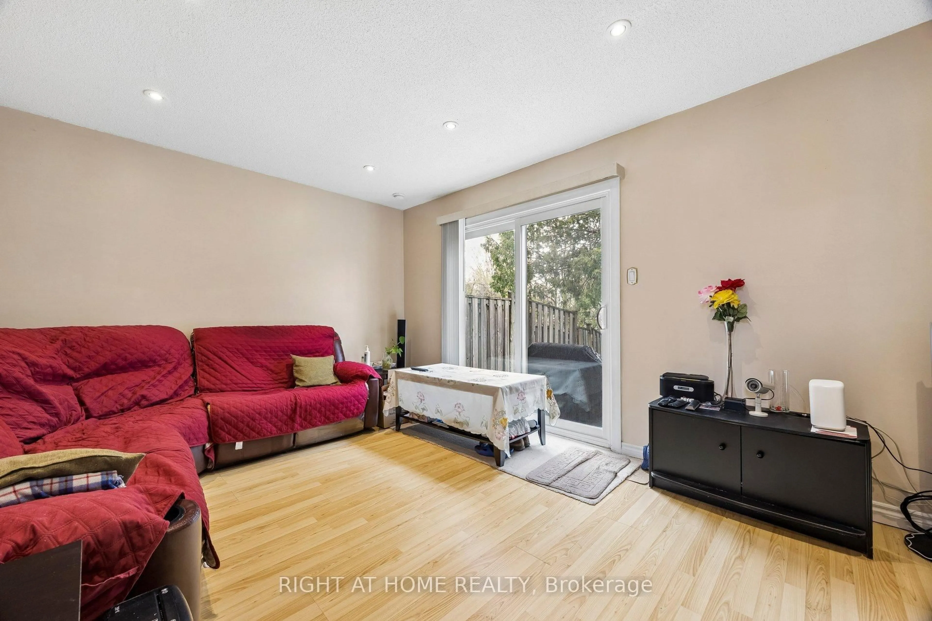 Living room with furniture, wood/laminate floor for 2002 Martin Grove Rd #5, Toronto Ontario M9V 4A3