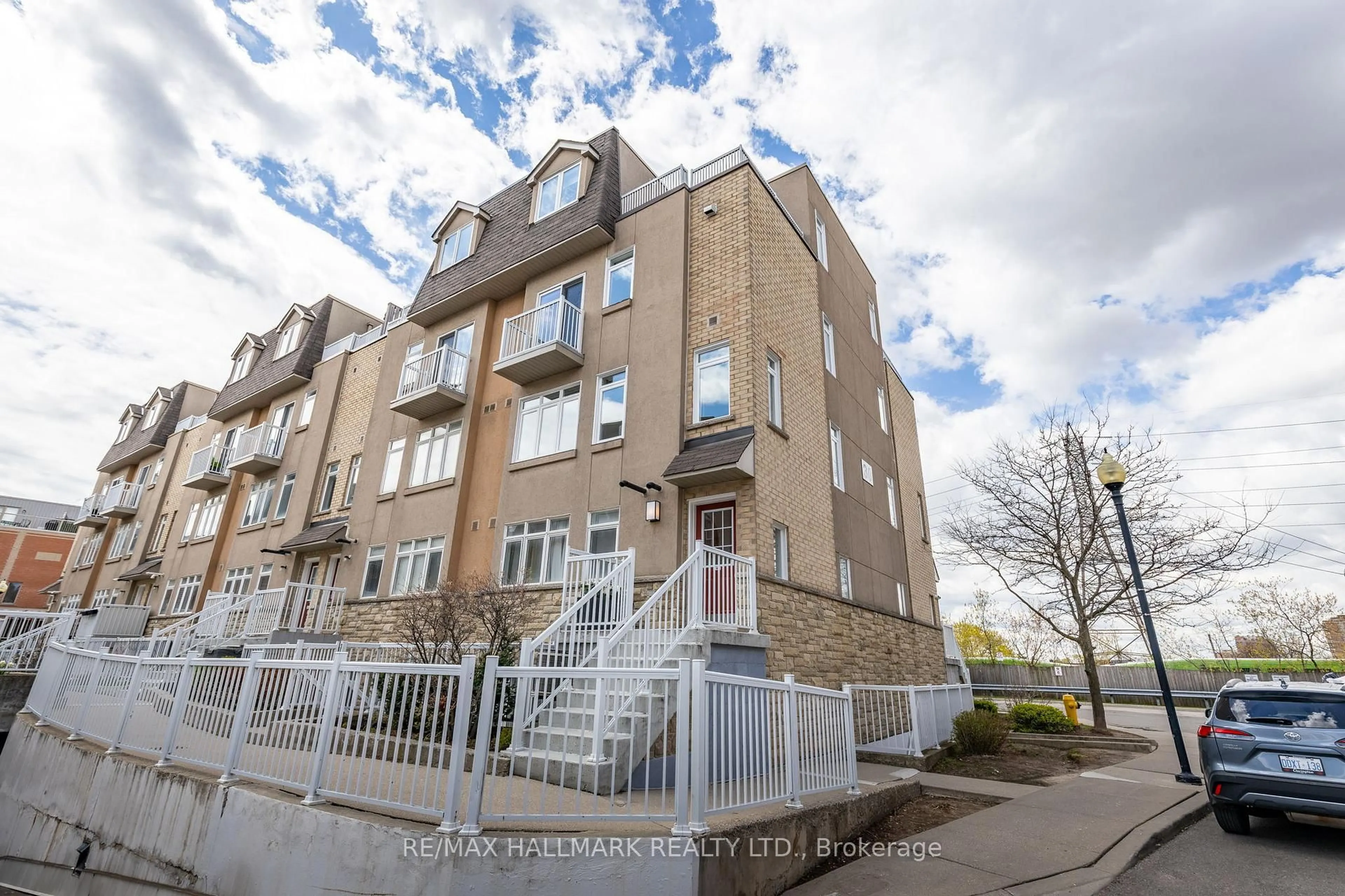 A pic from outside/outdoor area/front of a property/back of a property/a pic from drone, street for 30 Turntable Cres #47, Toronto Ontario M6H 4K9