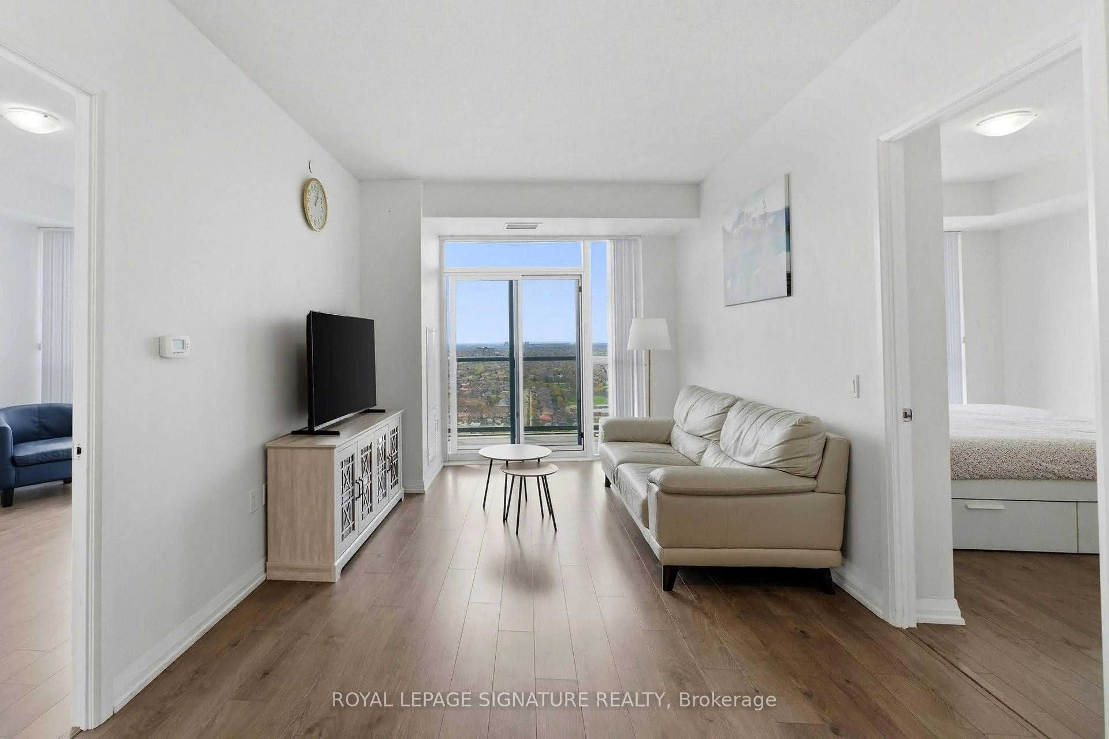 Living room with furniture, wood/laminate floor for 35 Watergarden Dr #2415, Mississauga Ontario L5R 0G8