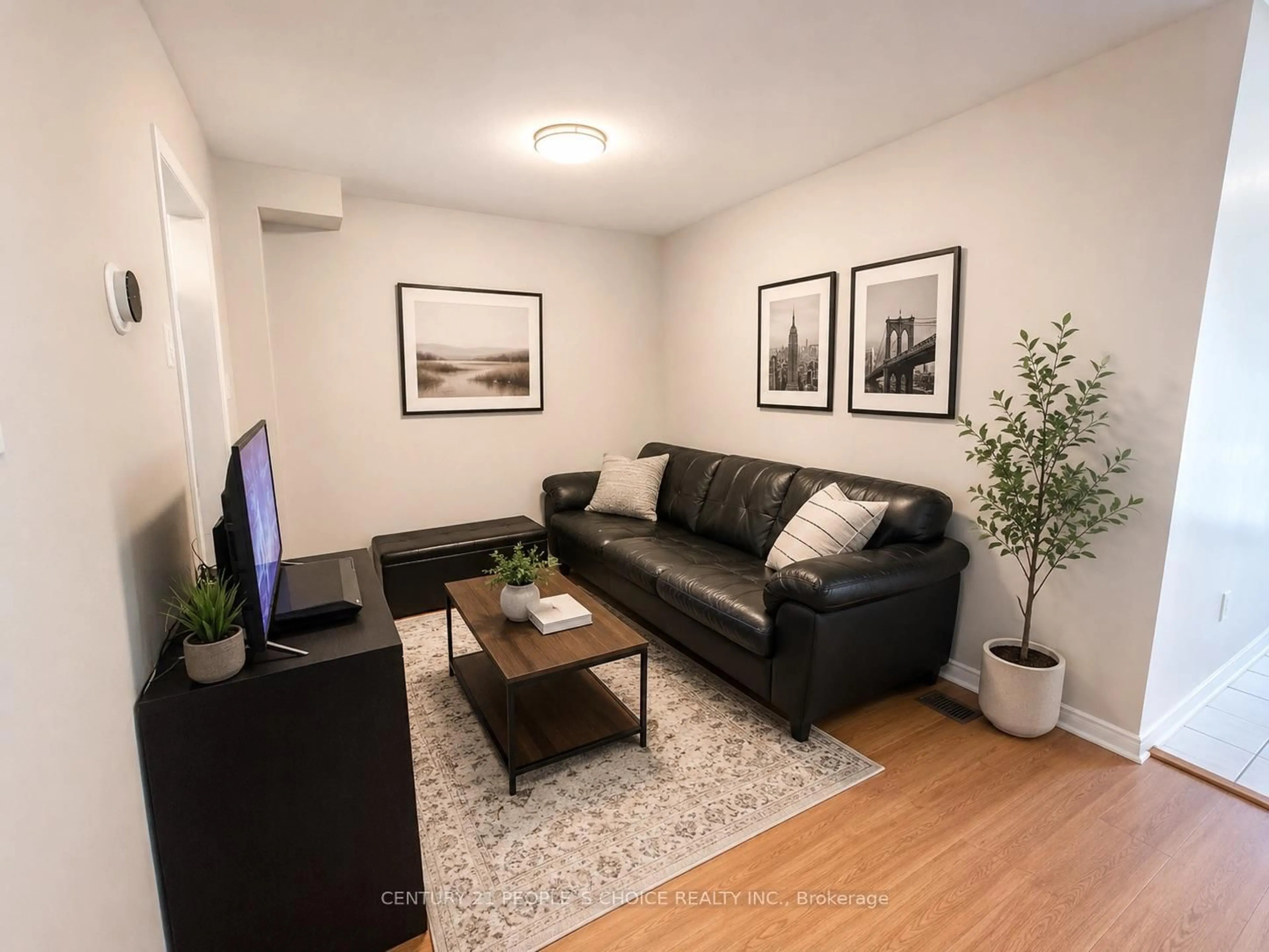 Living room with furniture, wood/laminate floor for 21 Cordgrass Cres, Brampton Ontario L6R 2A3