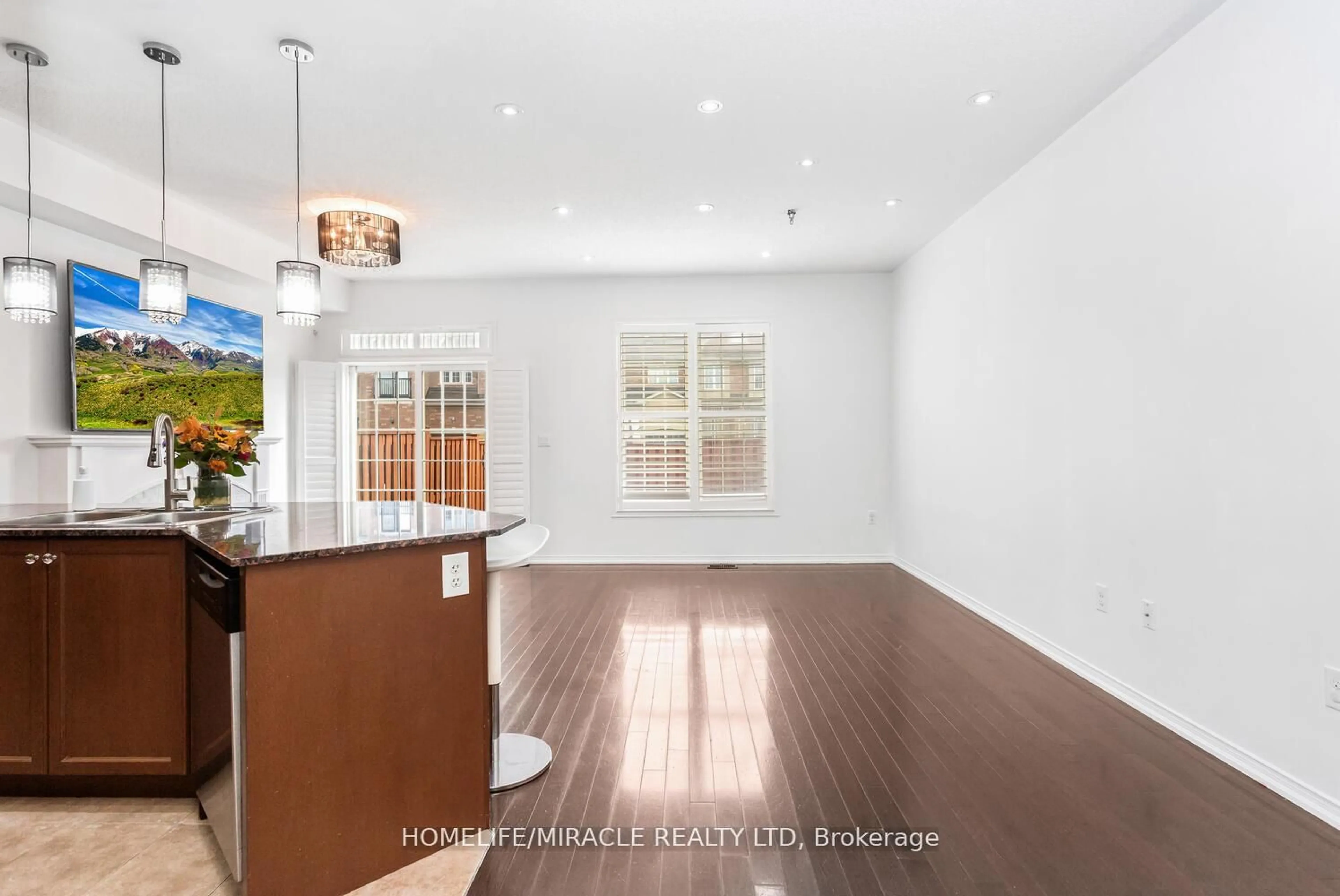 Open concept kitchen, wood/laminate floor for 745 Farmstead Dr #58, Milton Ontario L9T 8B2