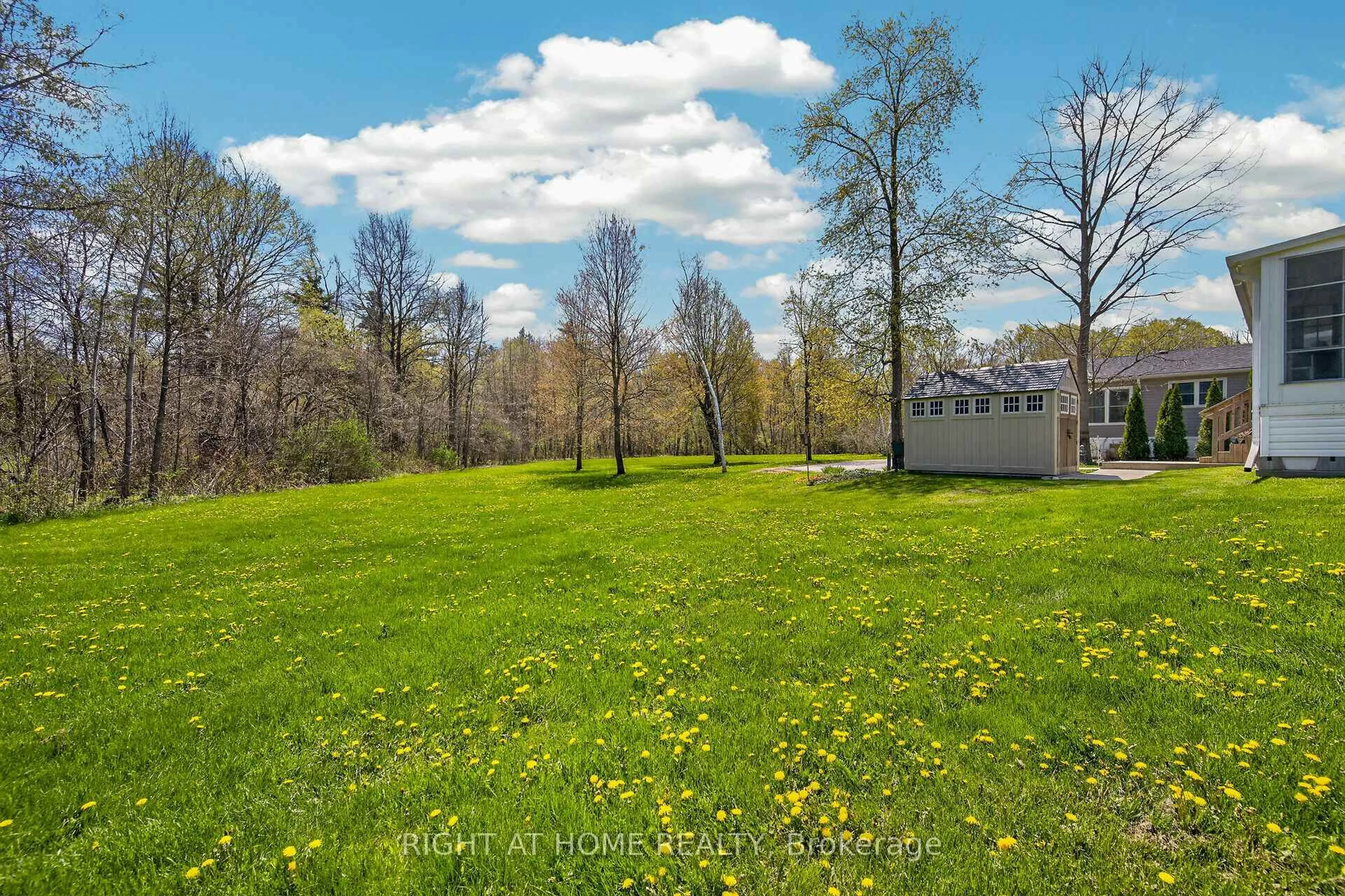 A pic from outside/outdoor area/front of a property/back of a property/a pic from drone, forest/trees view for 4449 Milburough Line #5 Beech, Burlington Ontario L7P 0C5