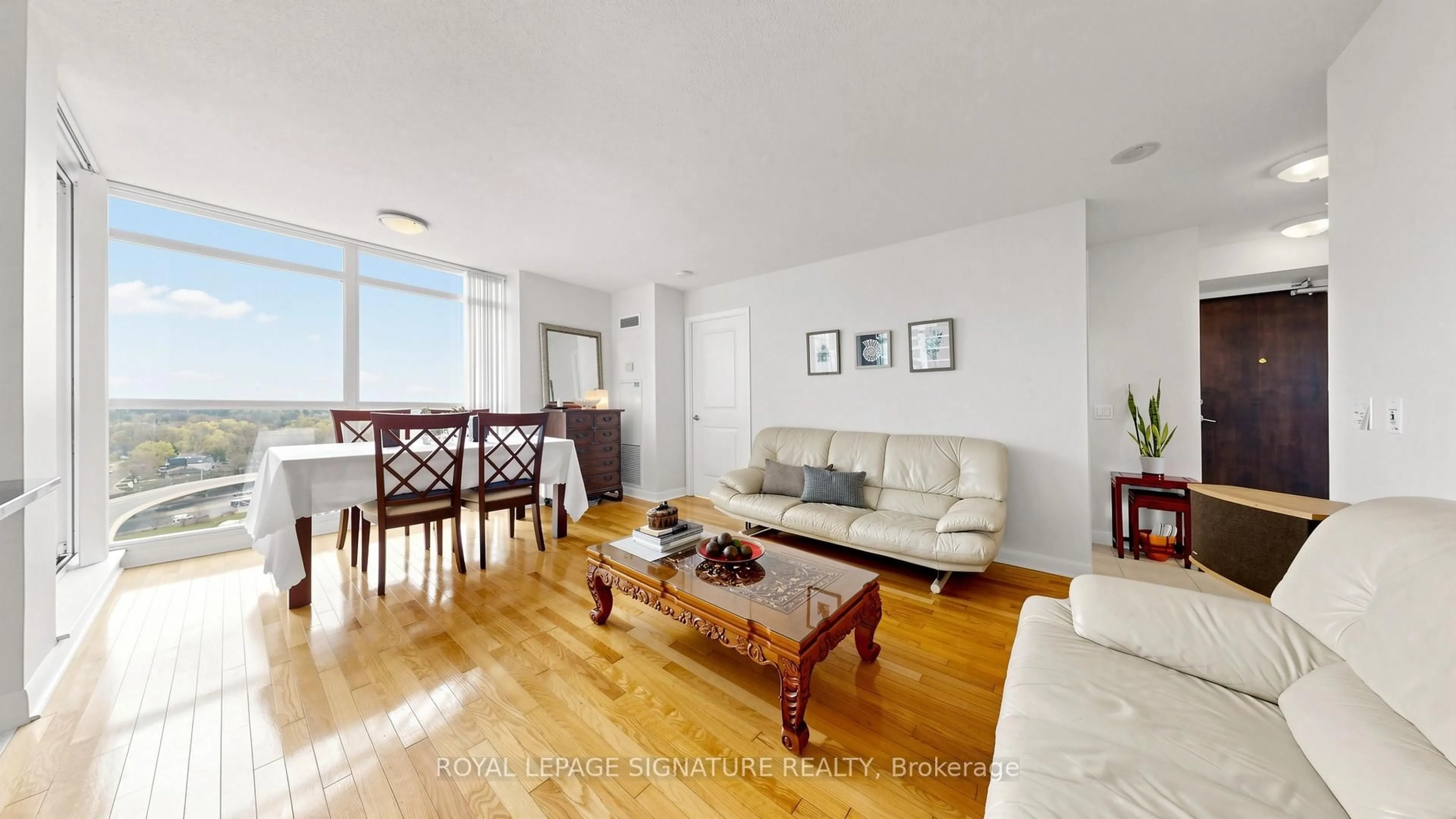 Living room with furniture, wood/laminate floor for 235 SHERWAY GARDENS Rd #1603, Toronto Ontario M9C 0A2