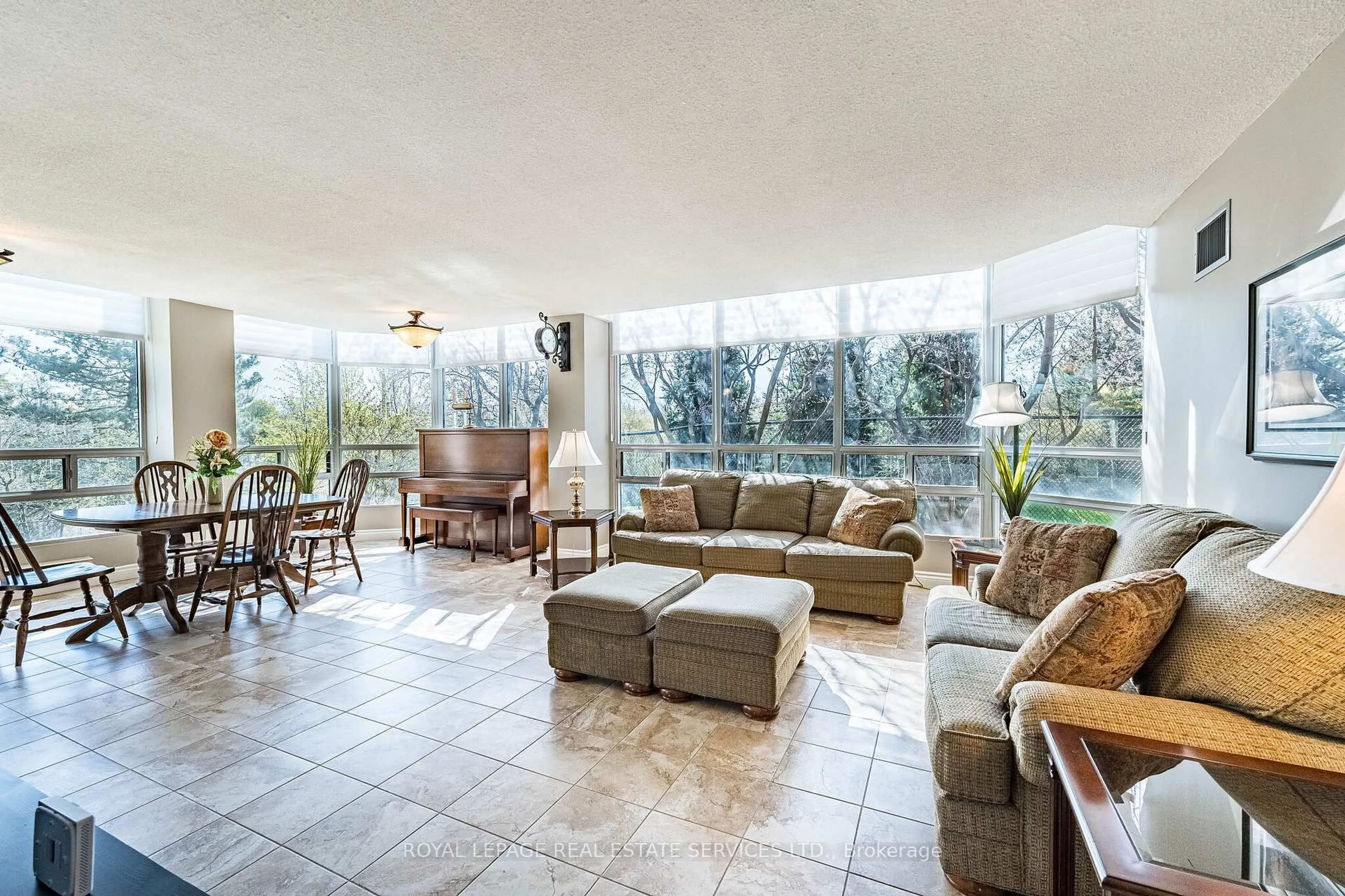 Living room with furniture, ceramic/tile floor for 310 Mill St #102, Brampton Ontario L6Y 3B1