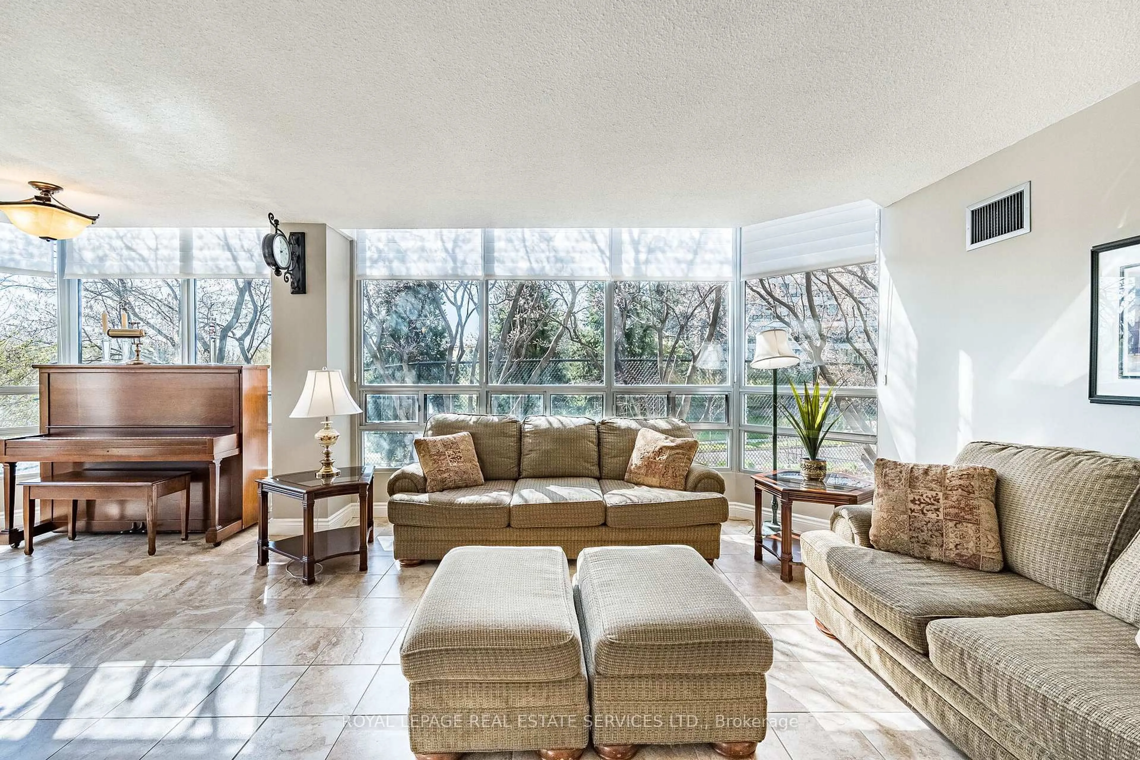Living room with furniture, ceramic/tile floor for 310 Mill St #102, Brampton Ontario L6Y 3B1