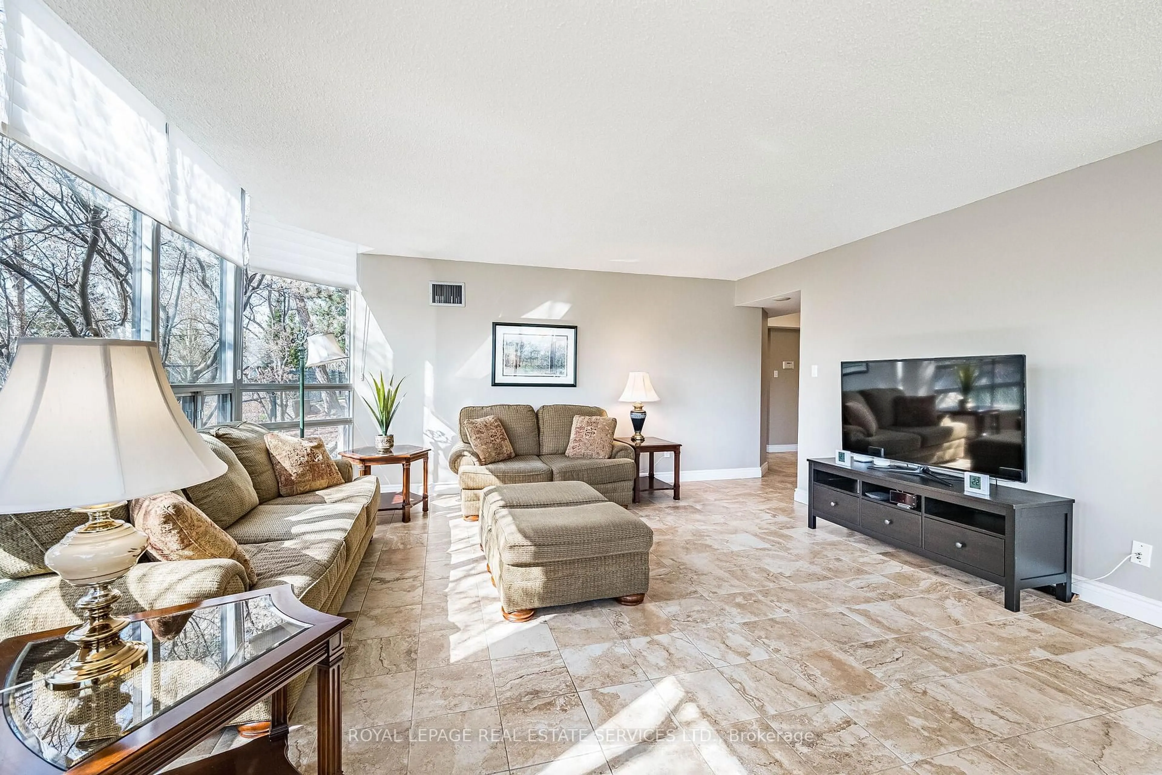 Living room with furniture, unknown for 310 Mill St #102, Brampton Ontario L6Y 3B1