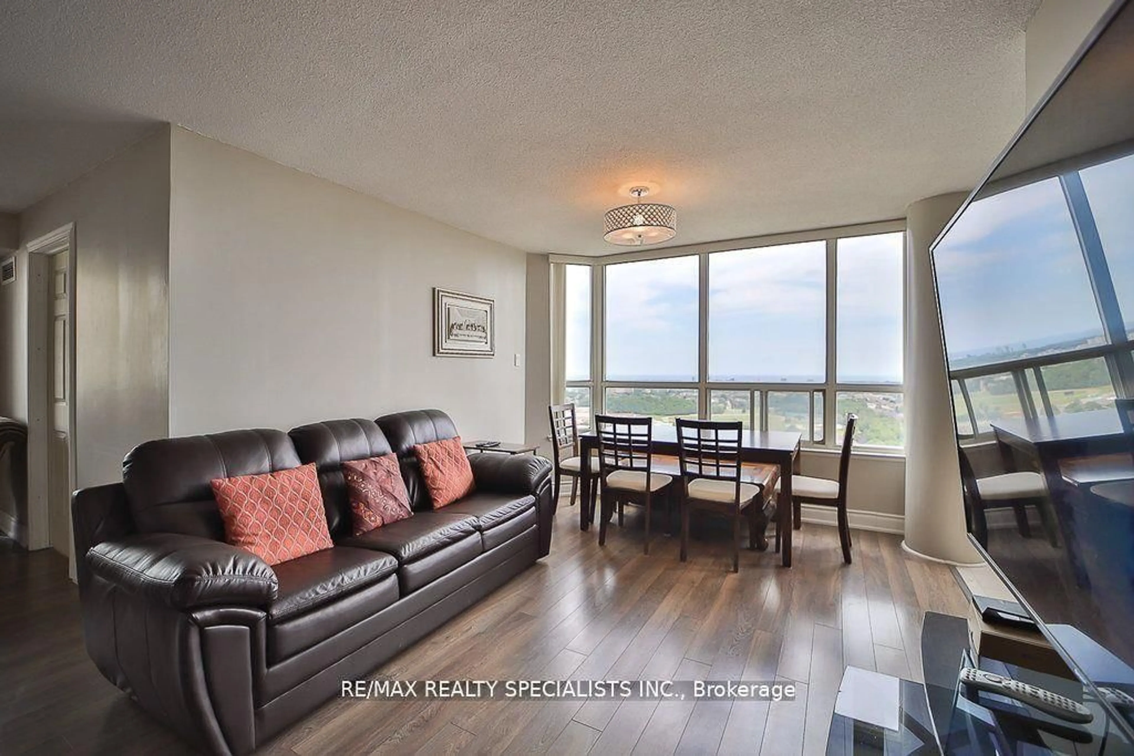 Living room with furniture, wood/laminate floor for 400 Webb Dr #2209, Mississauga Ontario L5B 3Z7