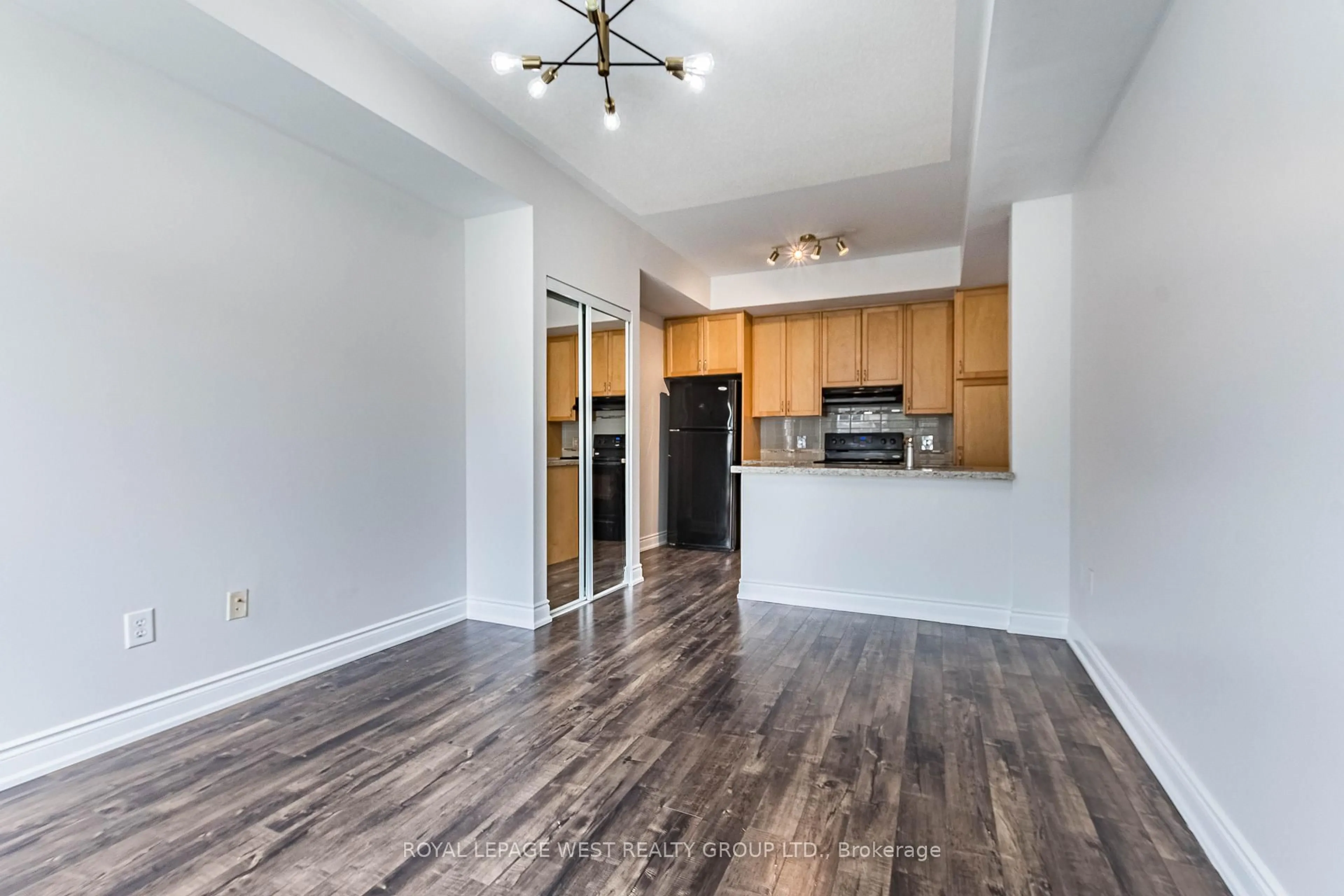 Open concept kitchen, wood/laminate floor for 5035 Oscar Peterson Blvd #110, Mississauga Ontario L5M 0P4