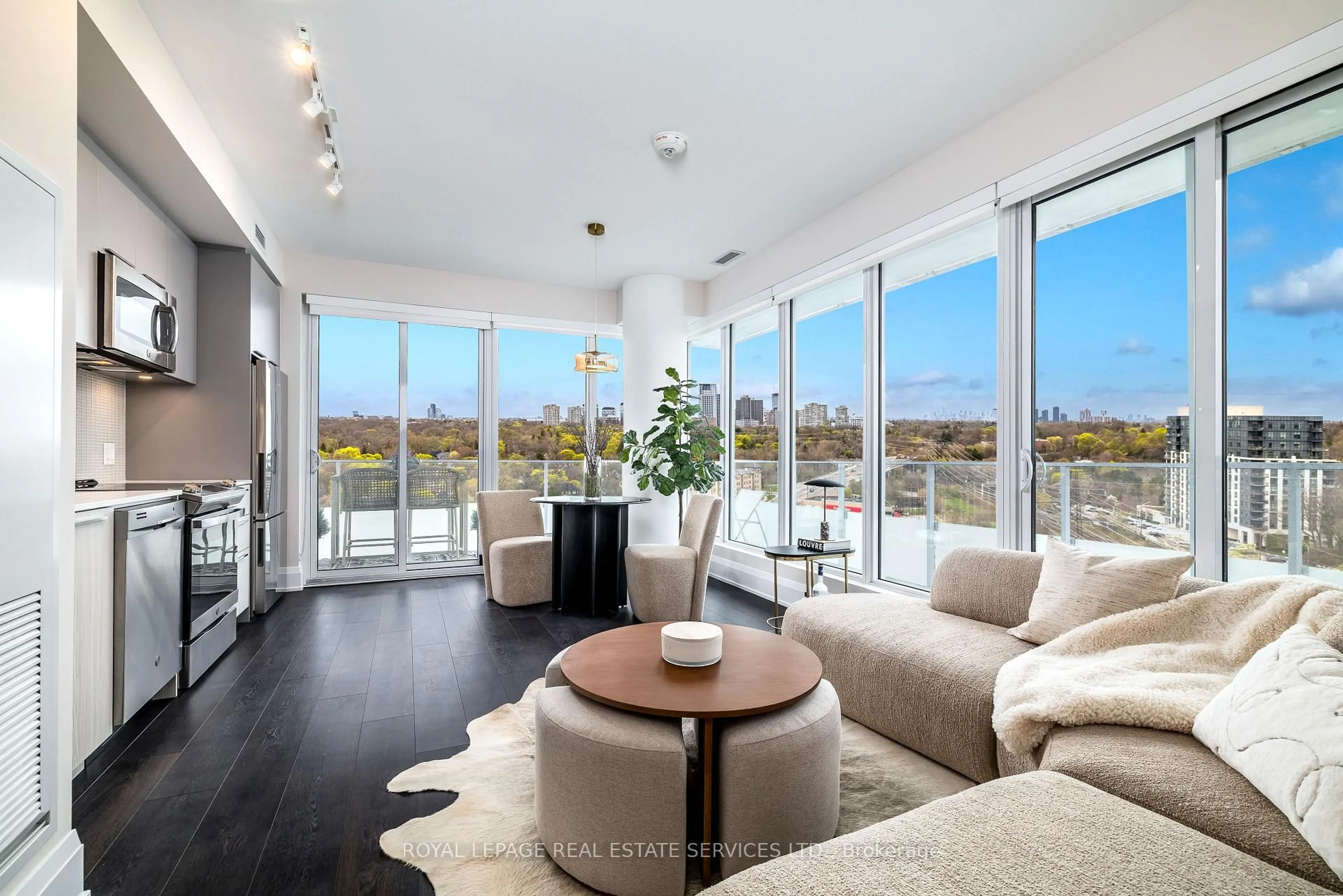 Living room with furniture, wood/laminate floor for 20 Brin Dr #1402, Toronto Ontario M8X 0B2
