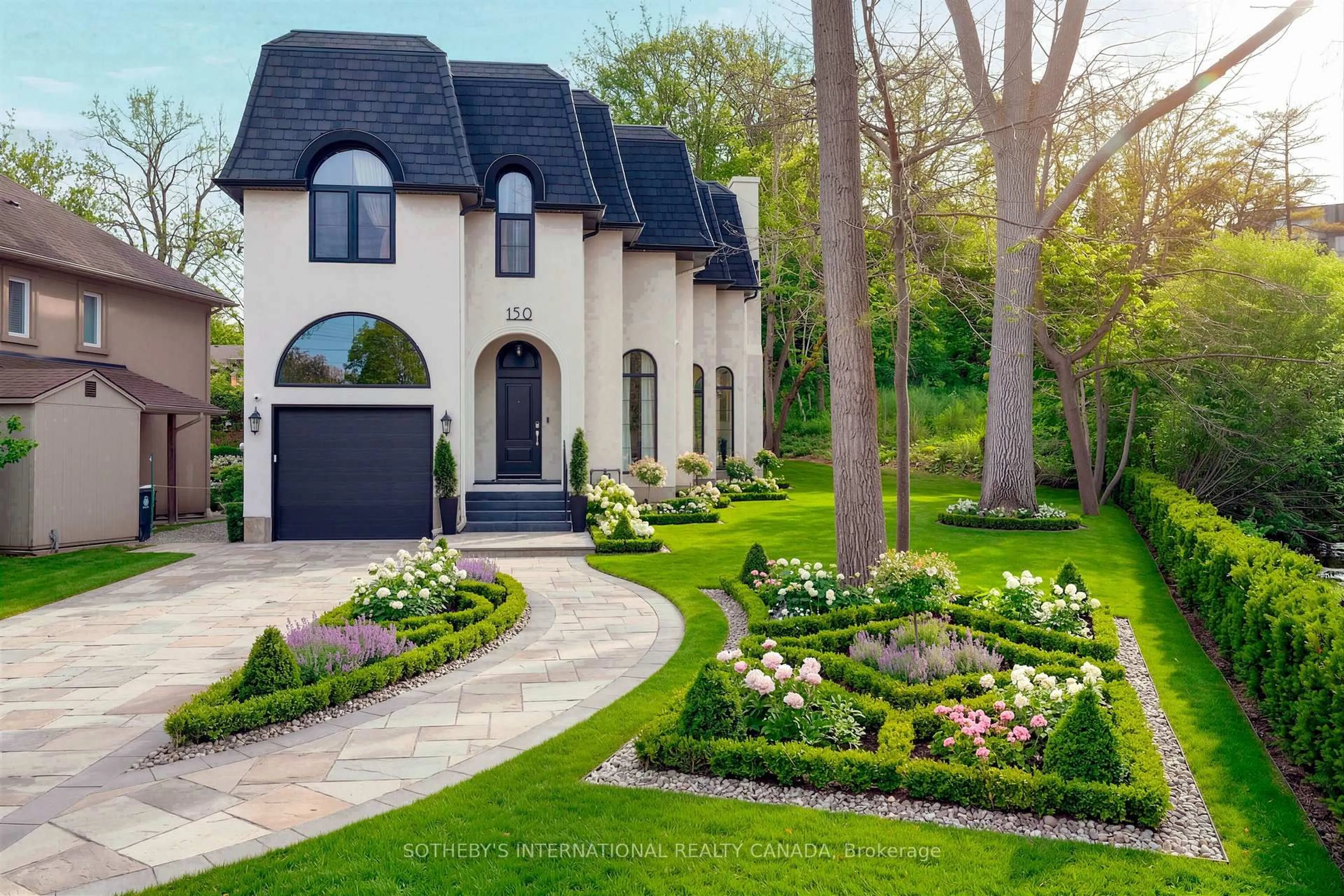 Home with brick exterior material, street for 150 Edenbridge Dr, Toronto Ontario M9A 3G6