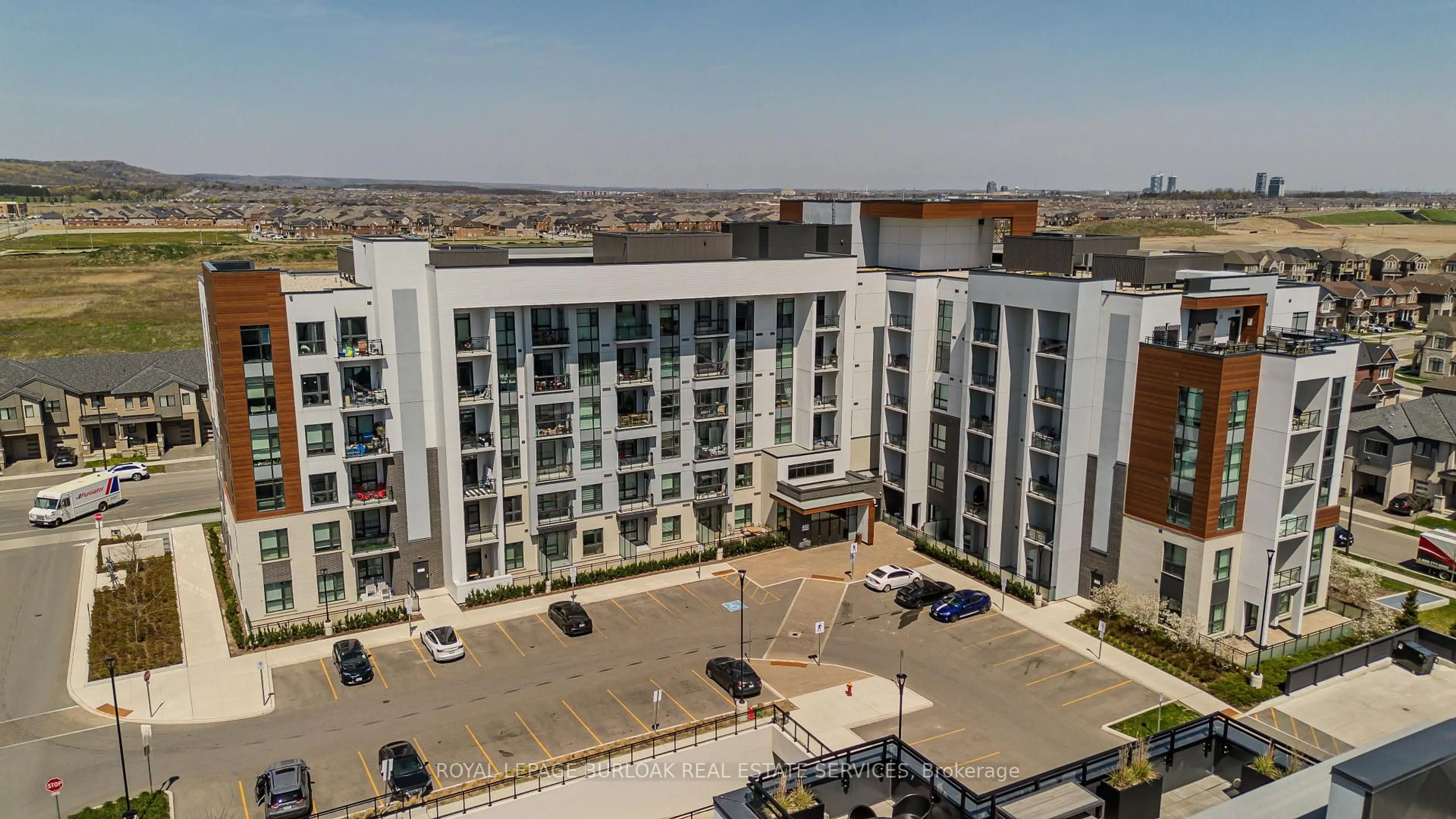 A pic from outside/outdoor area/front of a property/back of a property/a pic from drone, city buildings view from balcony for 460 Gordon Krantz Ave #112, Milton Ontario L9E 1Z2