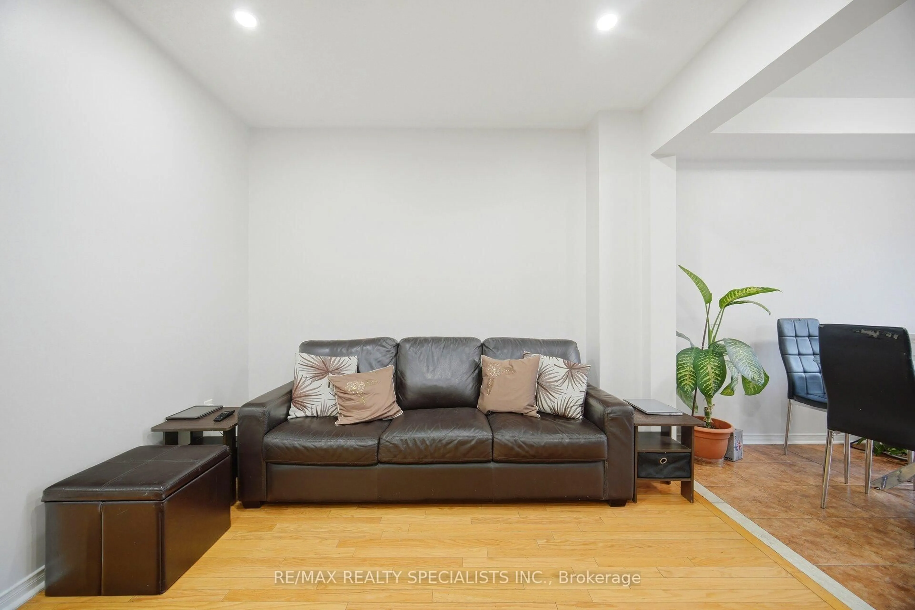 Living room with furniture, wood/laminate floor for 44 Galtee Rd, Brampton Ontario L6X 0J5