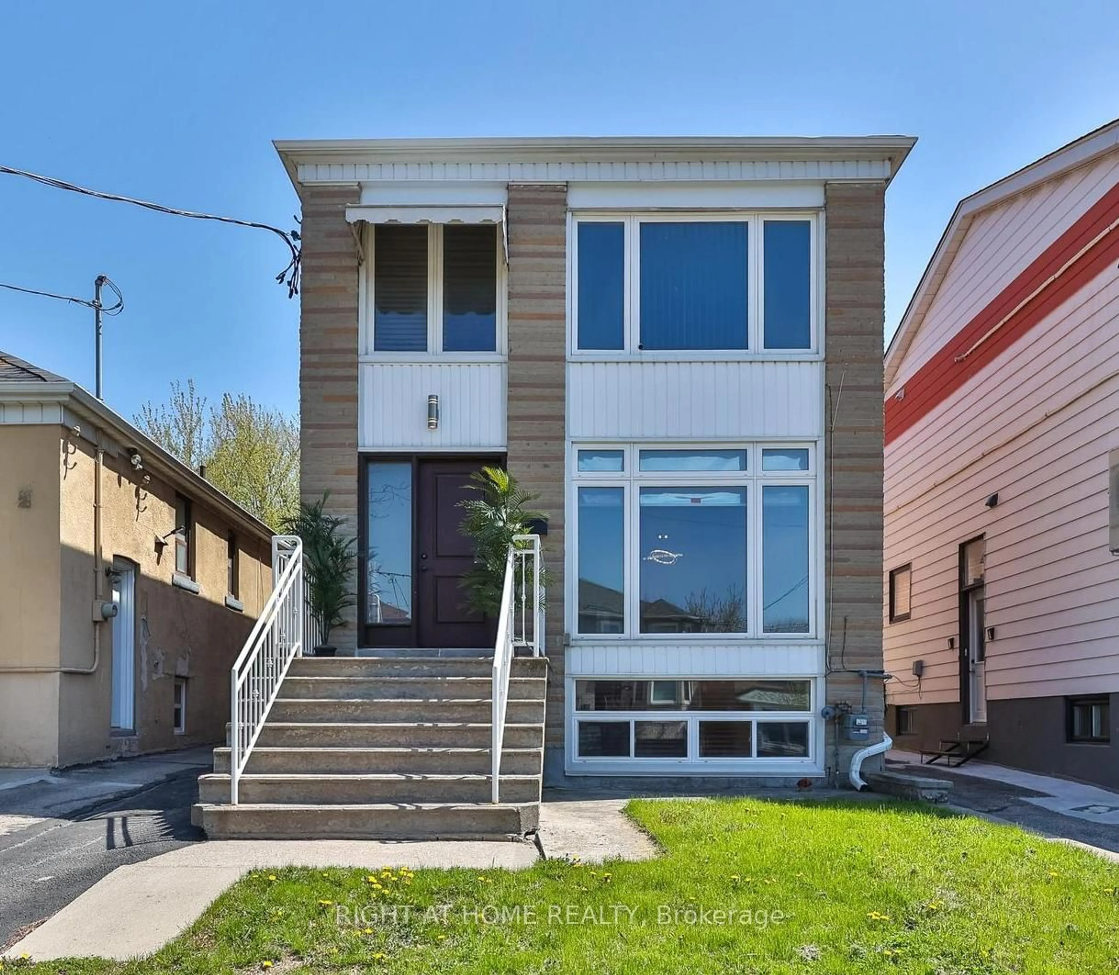 Home with brick exterior material, street for 65 Branstone Rd, Toronto Ontario M6E 4E3