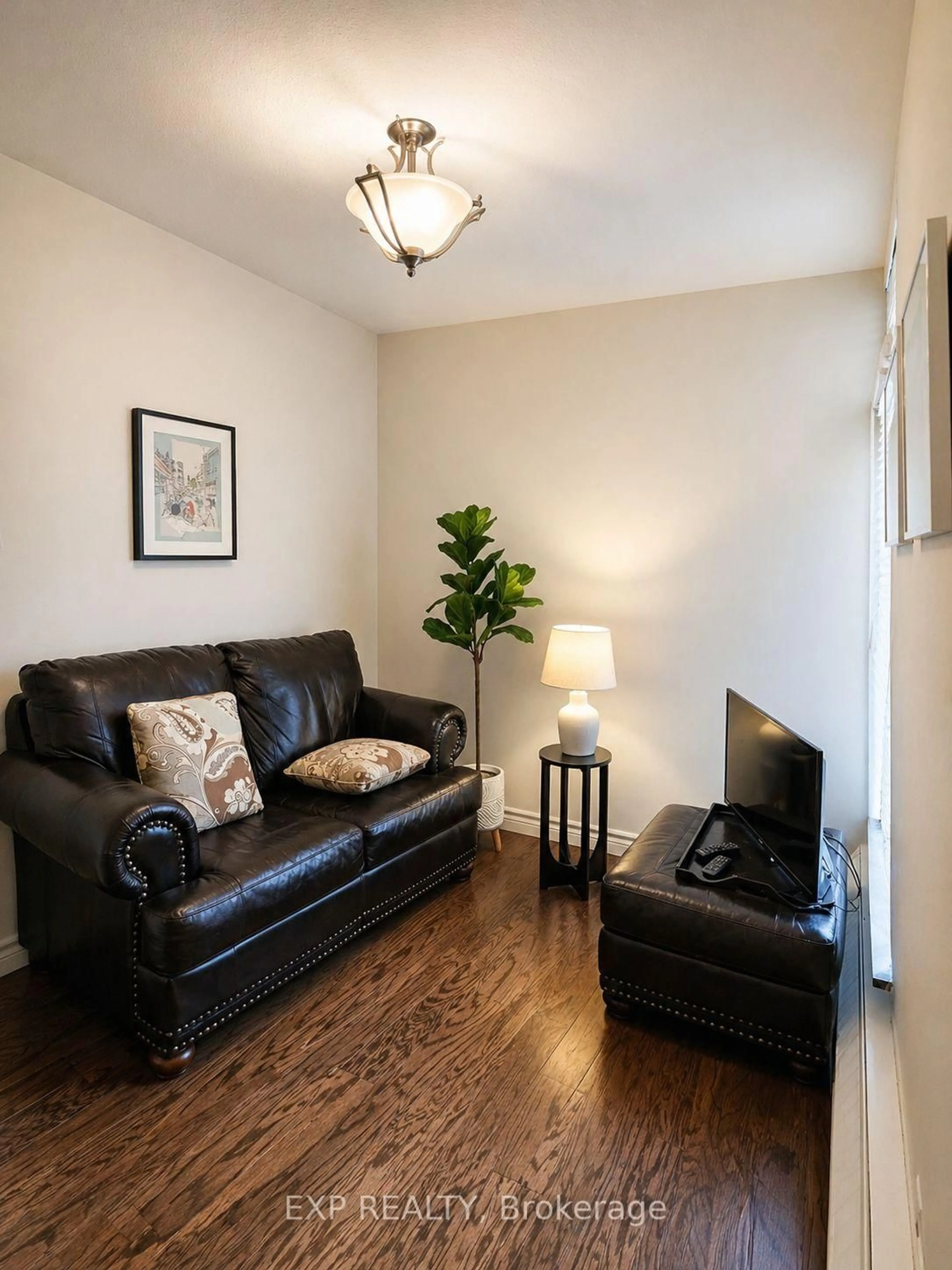 Living room with furniture, wood/laminate floor for 60 Southport St #617, Toronto Ontario M6S 3N4