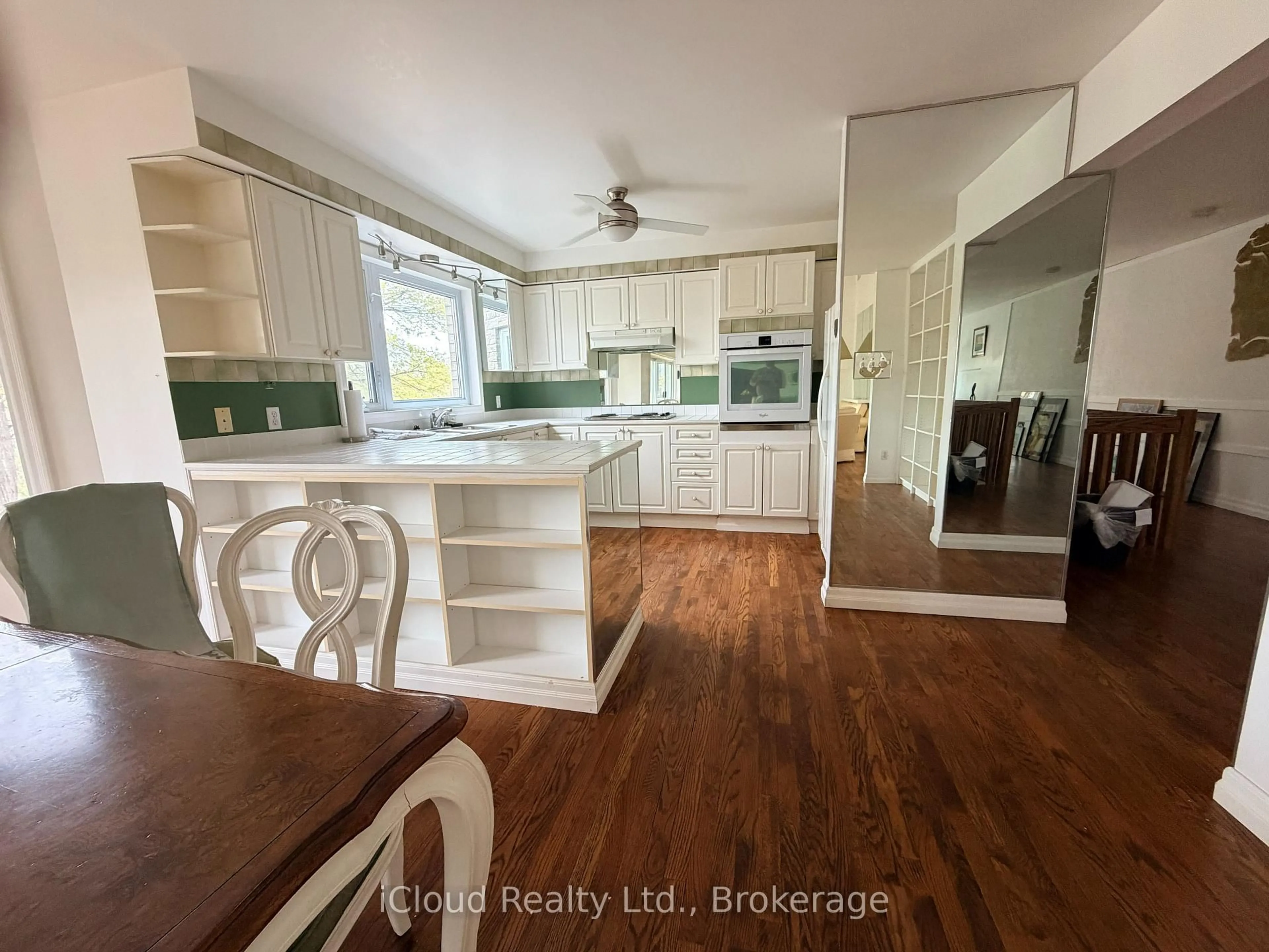 Open concept kitchen, wood/laminate floor for 176 Wyndham St, Mississauga Ontario L5M 1N5