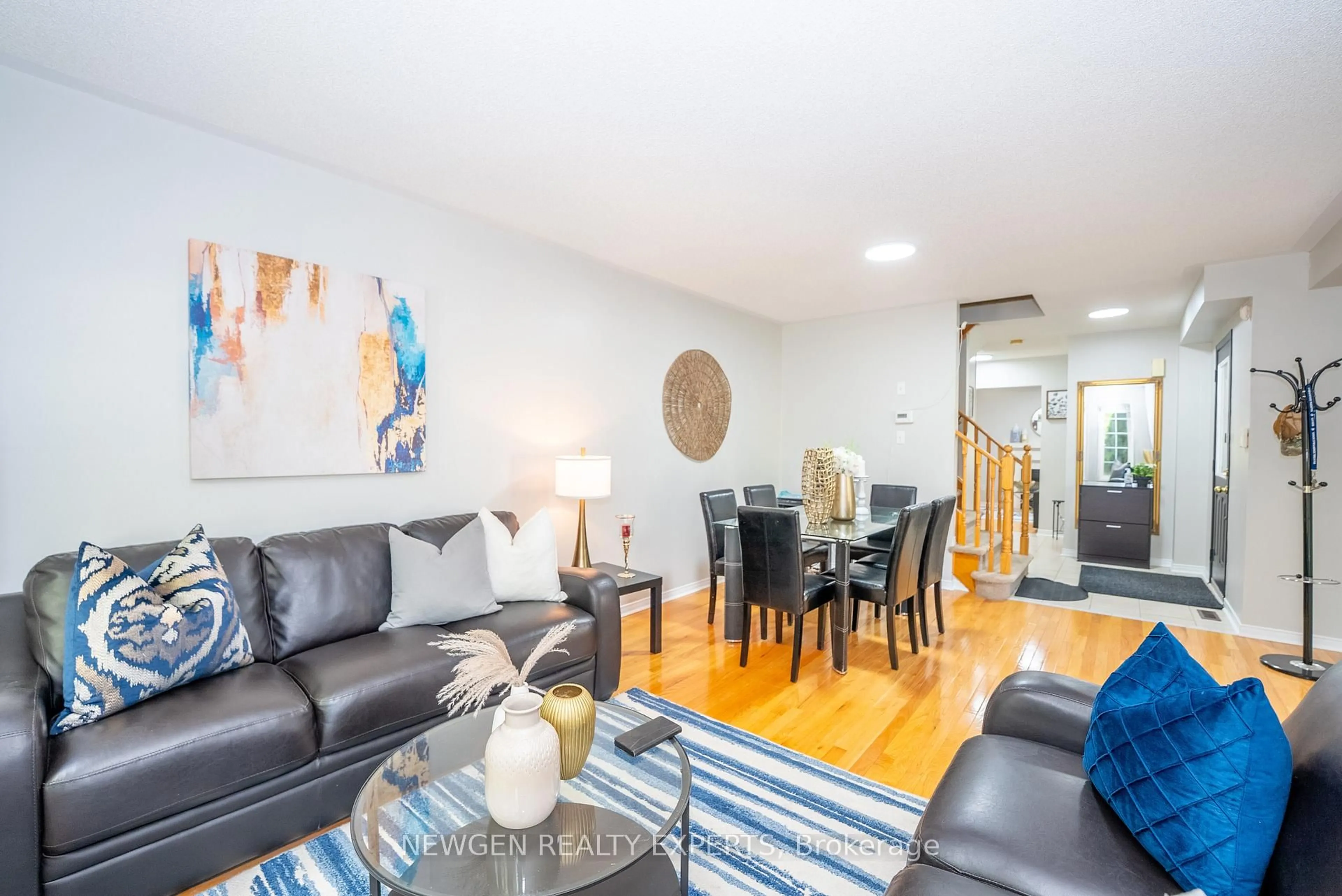 Living room with furniture, wood/laminate floor for 87 Luella Cres, Brampton Ontario L7A 3H5
