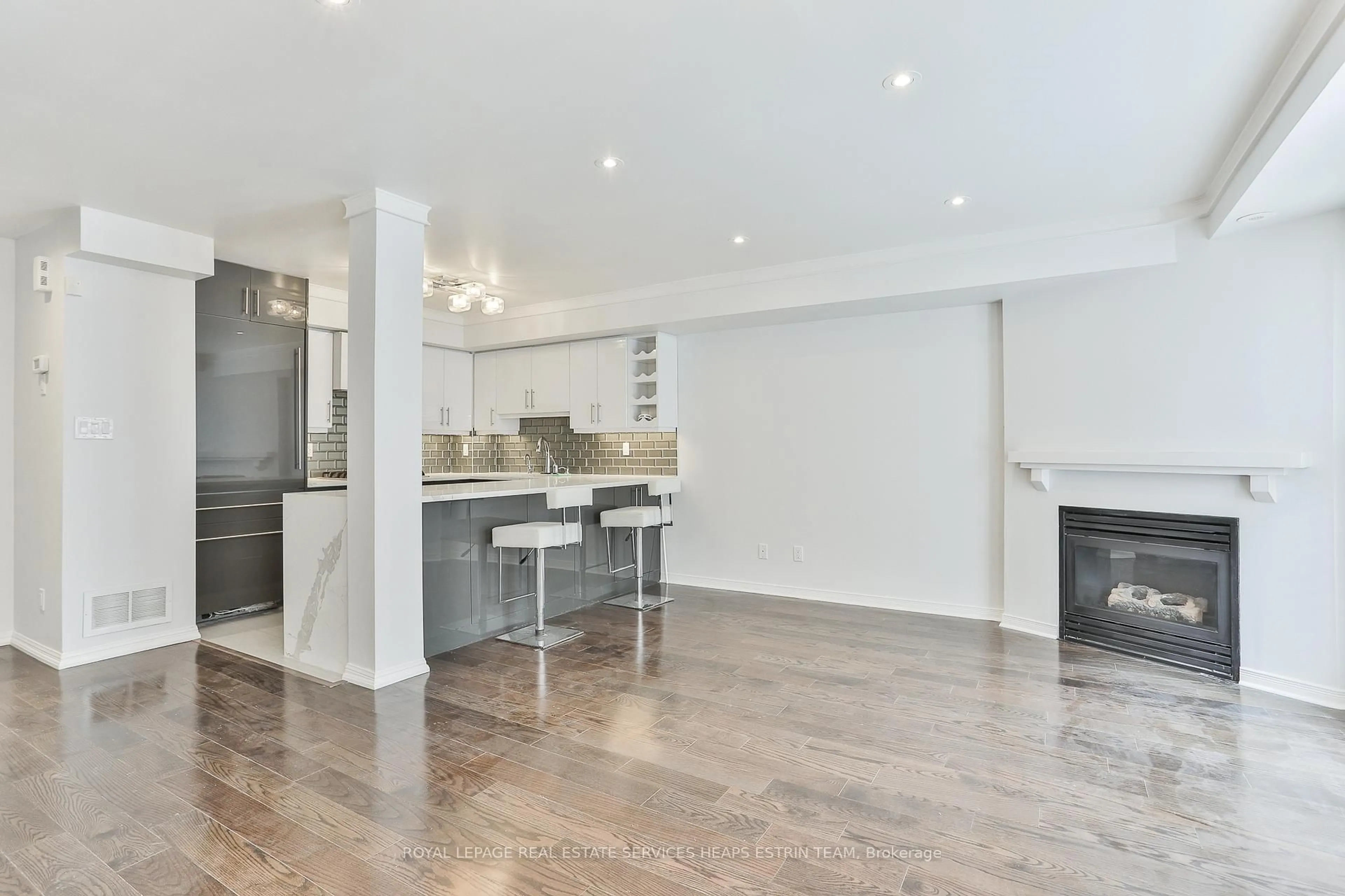 Open concept kitchen, wood/laminate floor for 50 Joe Shuster Way #215, Toronto Ontario M6K 1Y8