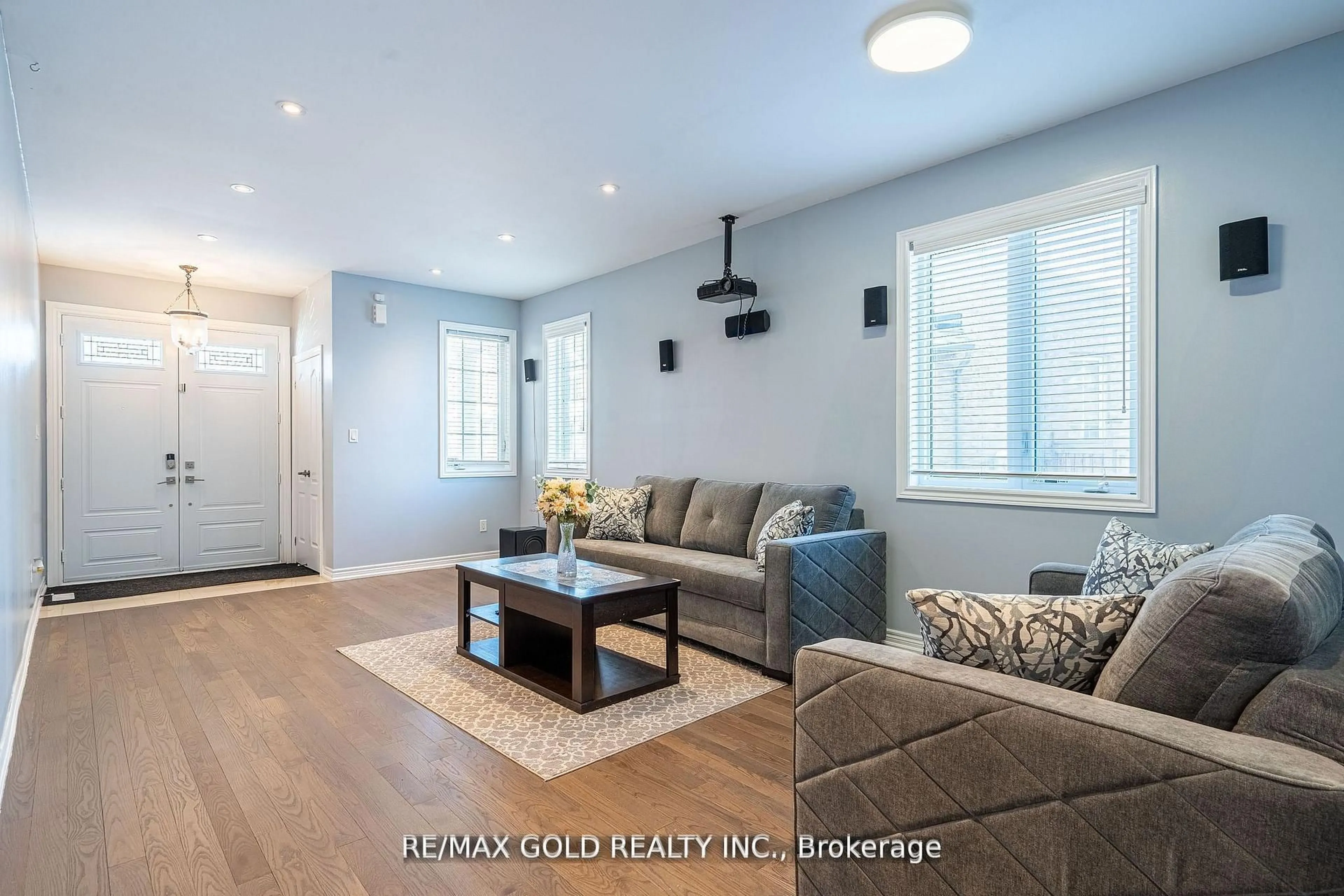 Living room with furniture, wood/laminate floor for 10 Spokanne St, Brampton Ontario L6R 4A2