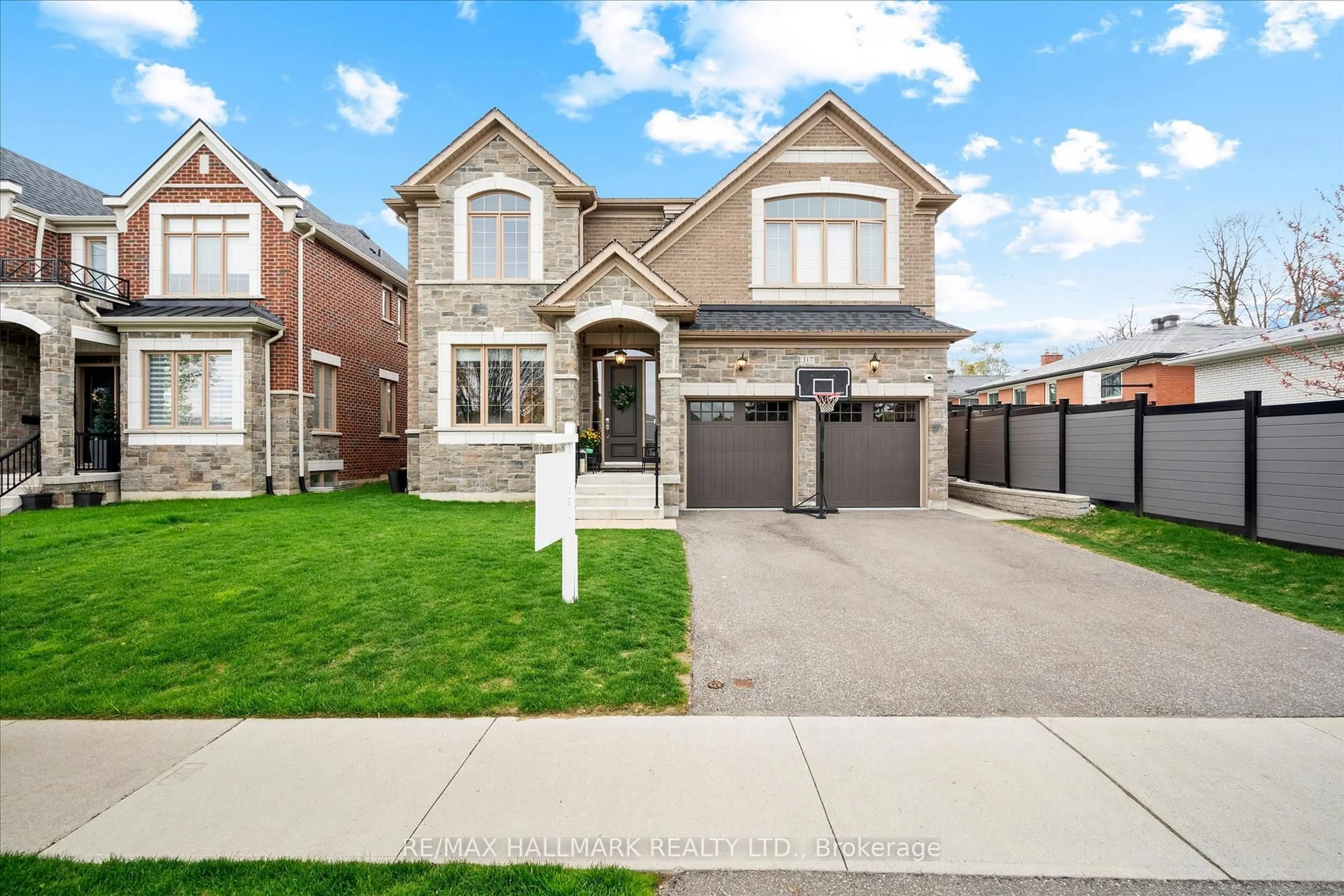 Home with brick exterior material, street for 317 La Rose Ave, Toronto Ontario M9P 1B8