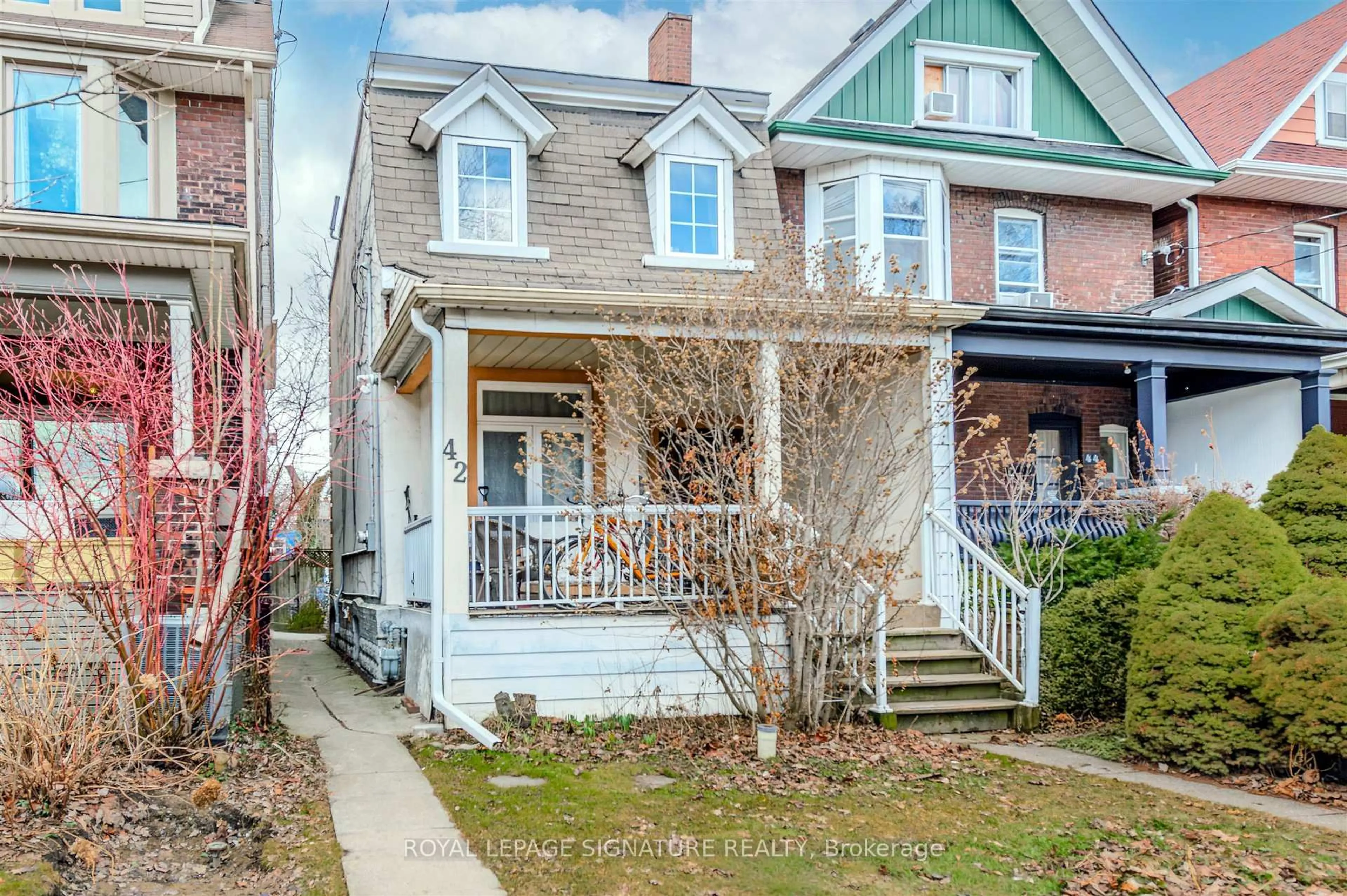 Home with brick exterior material, street for 42 Sorauren Ave, Toronto Ontario M6R 2C7