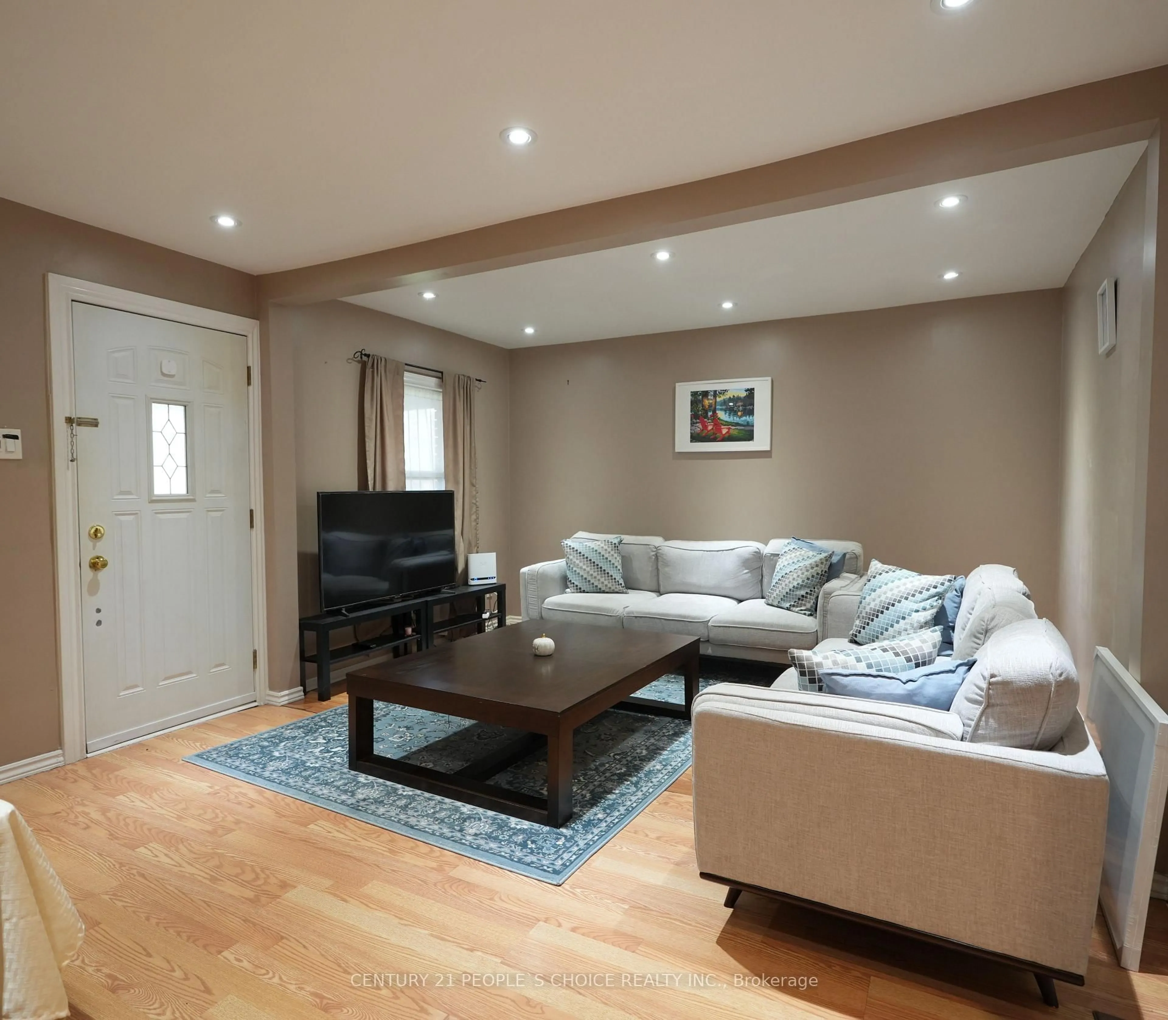 Living room with furniture, wood/laminate floor for 150 Spears St, Toronto Ontario M6N 3X7