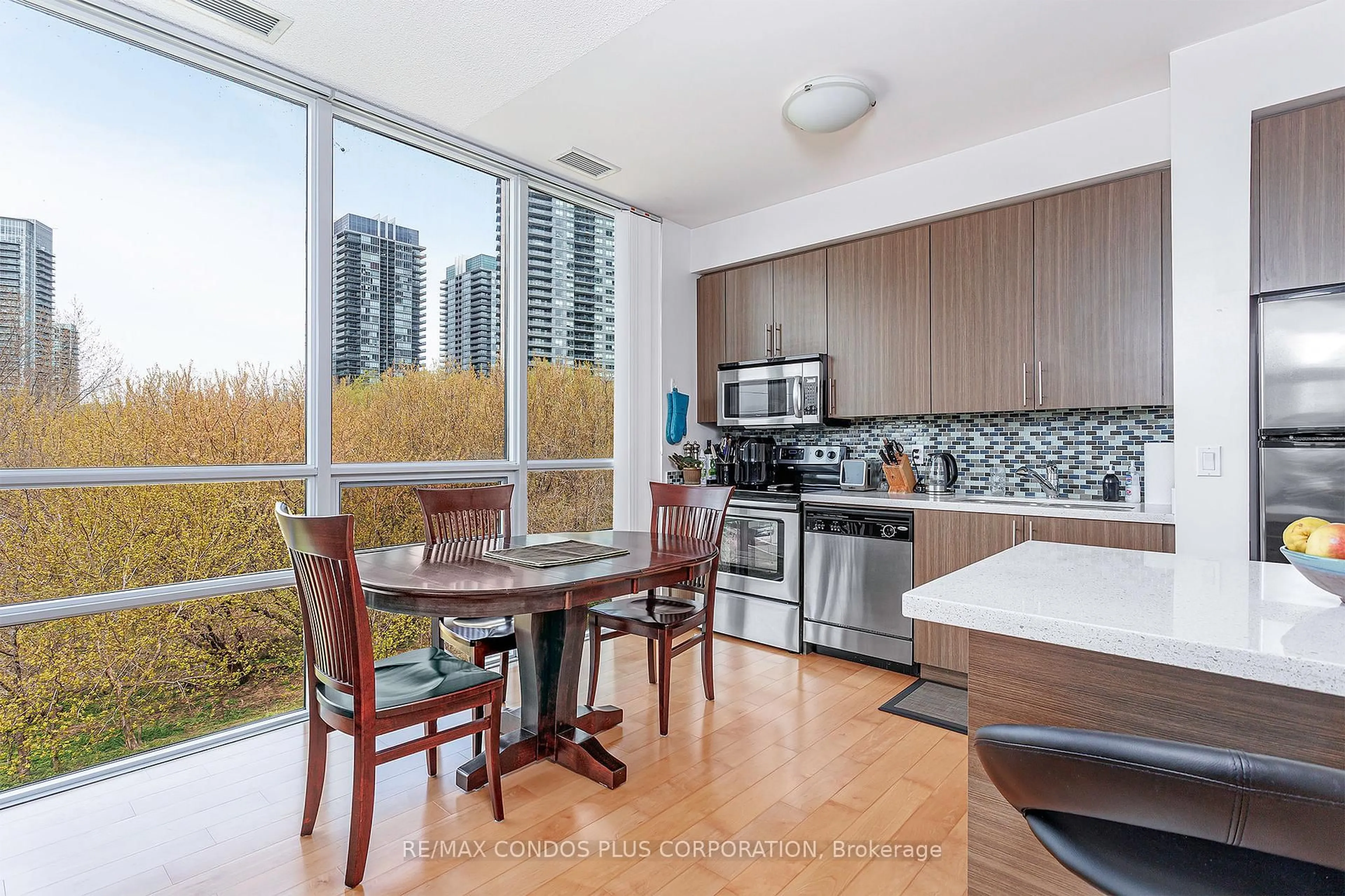Open concept kitchen, wood/laminate floor for 15 Legion Rd #206, Toronto Ontario M8V 0A9