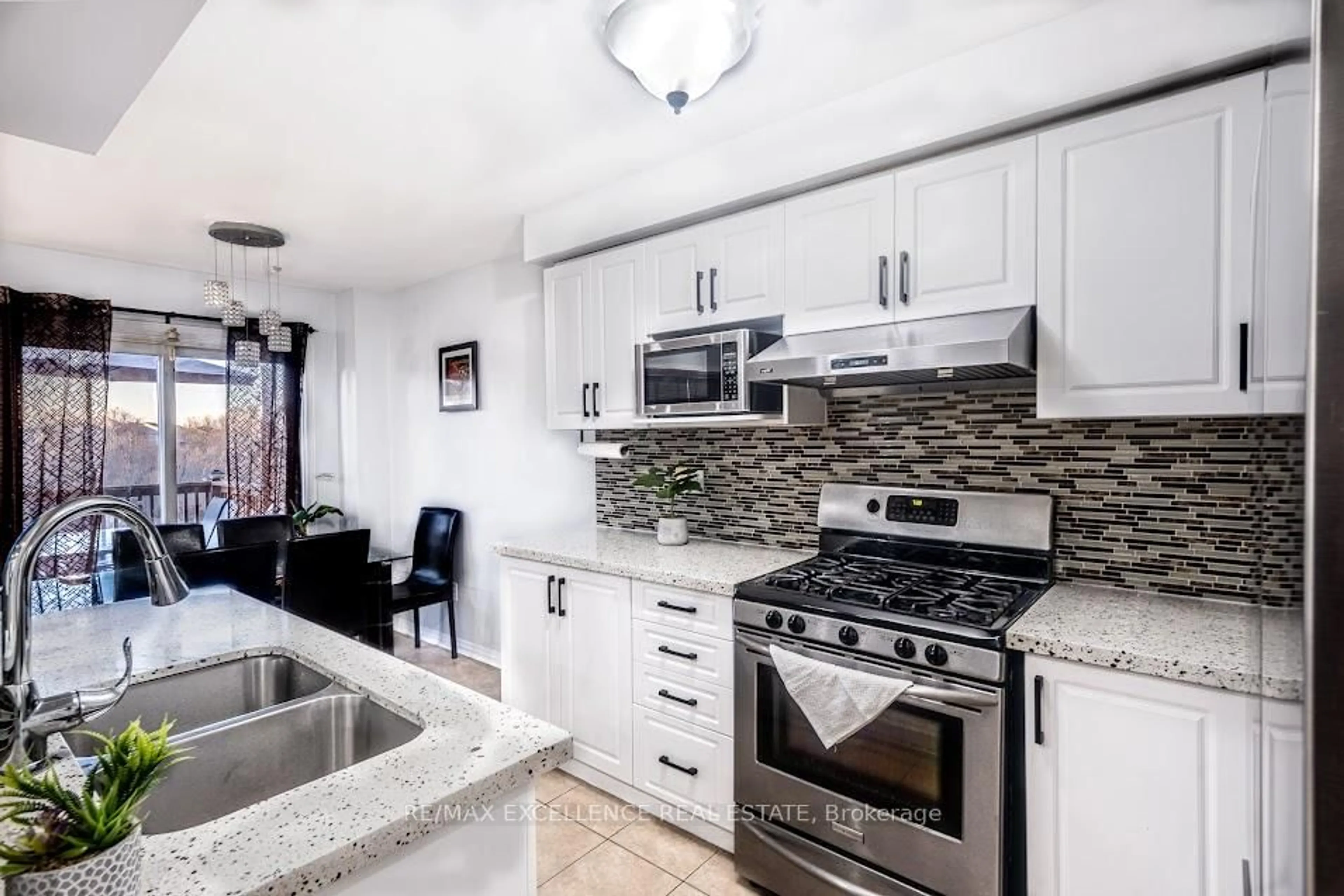 Open concept kitchen, ceramic/tile floor for 99 Rockgarden Tr, Brampton Ontario L6R 3N1
