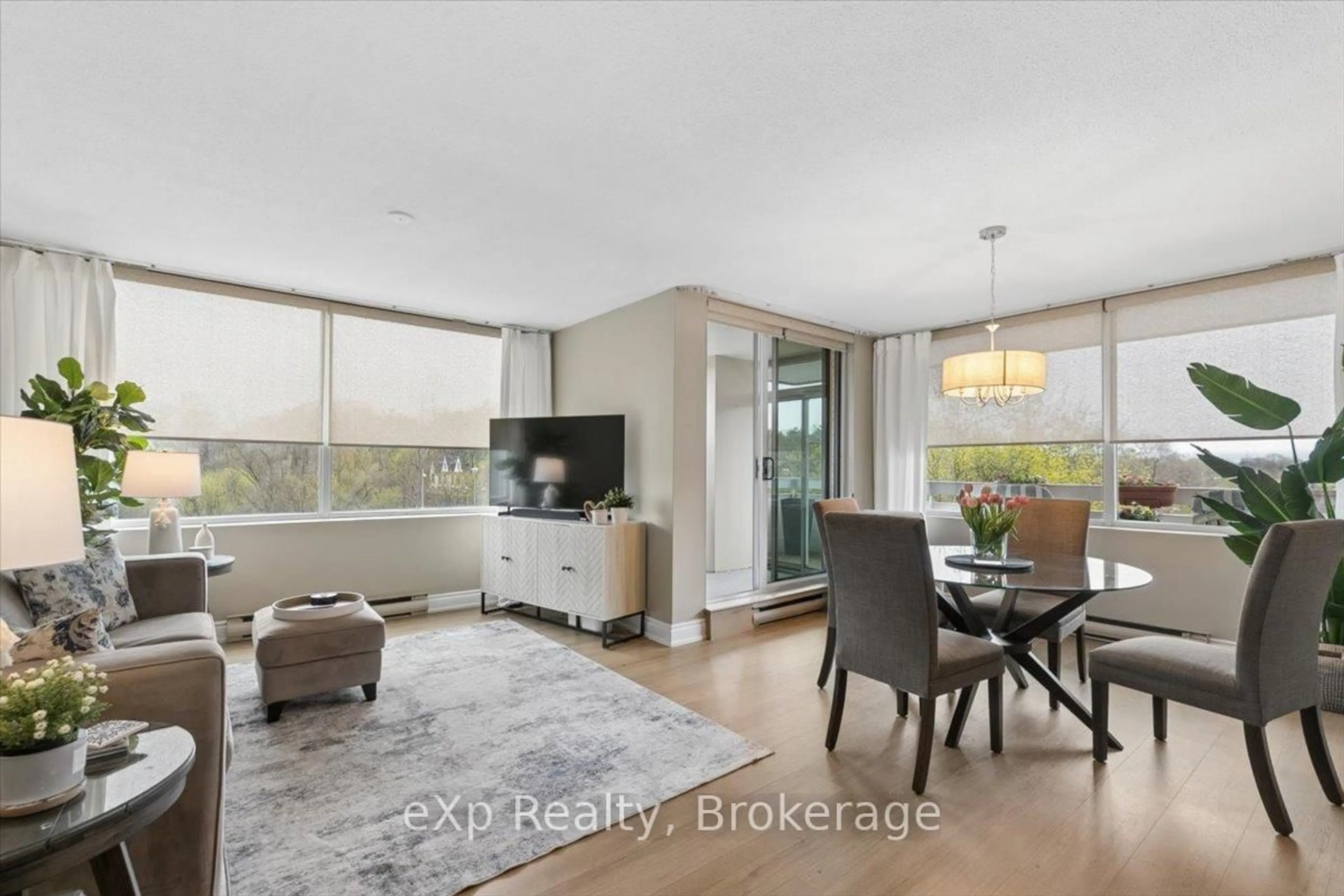 Living room with furniture, wood/laminate floor for 39 Stavebank Rd #403, Mississauga Ontario L5G 4N7