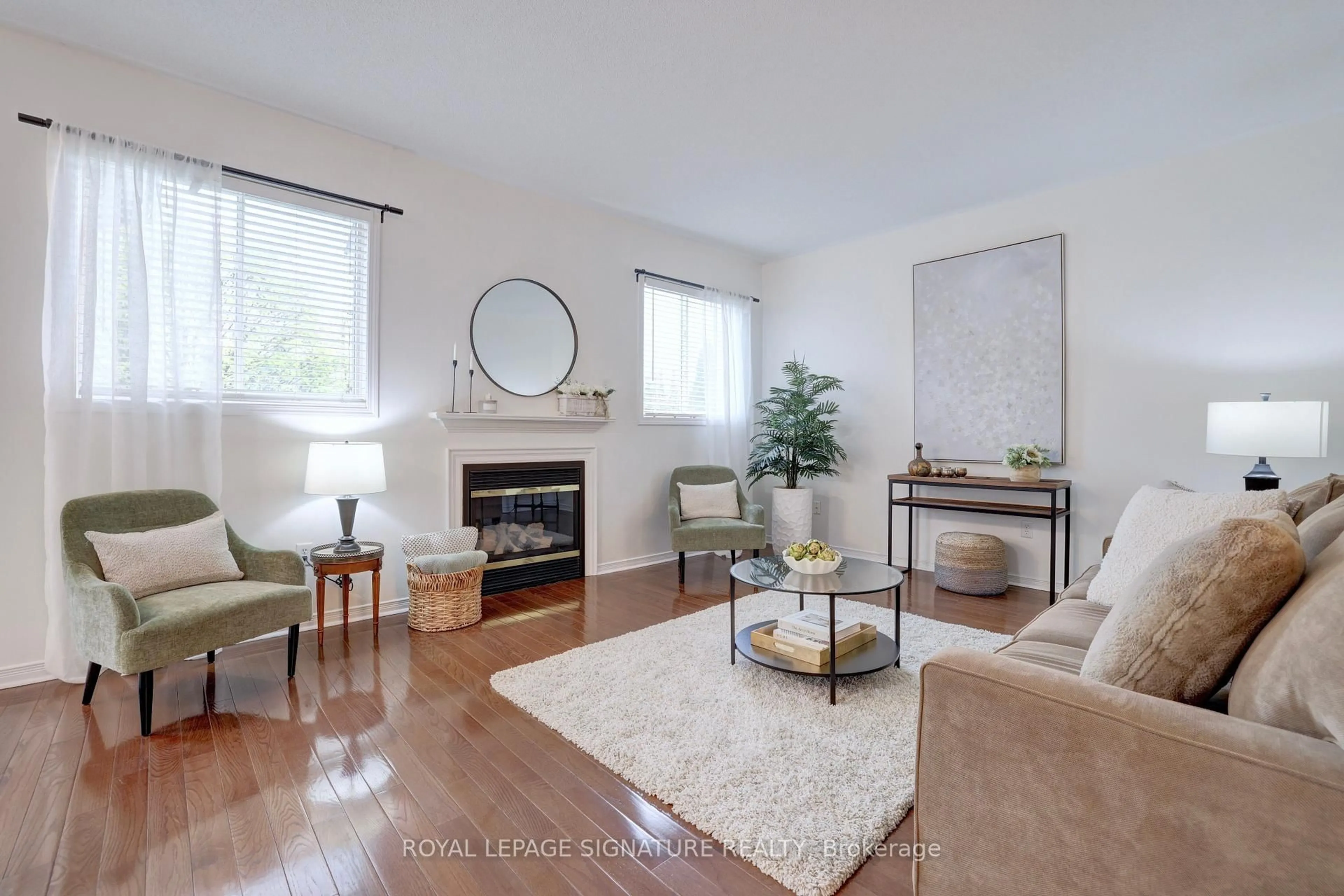 Living room with furniture, wood/laminate floor for 798 Spinning Wheel Cres, Mississauga Ontario L5W 1W4