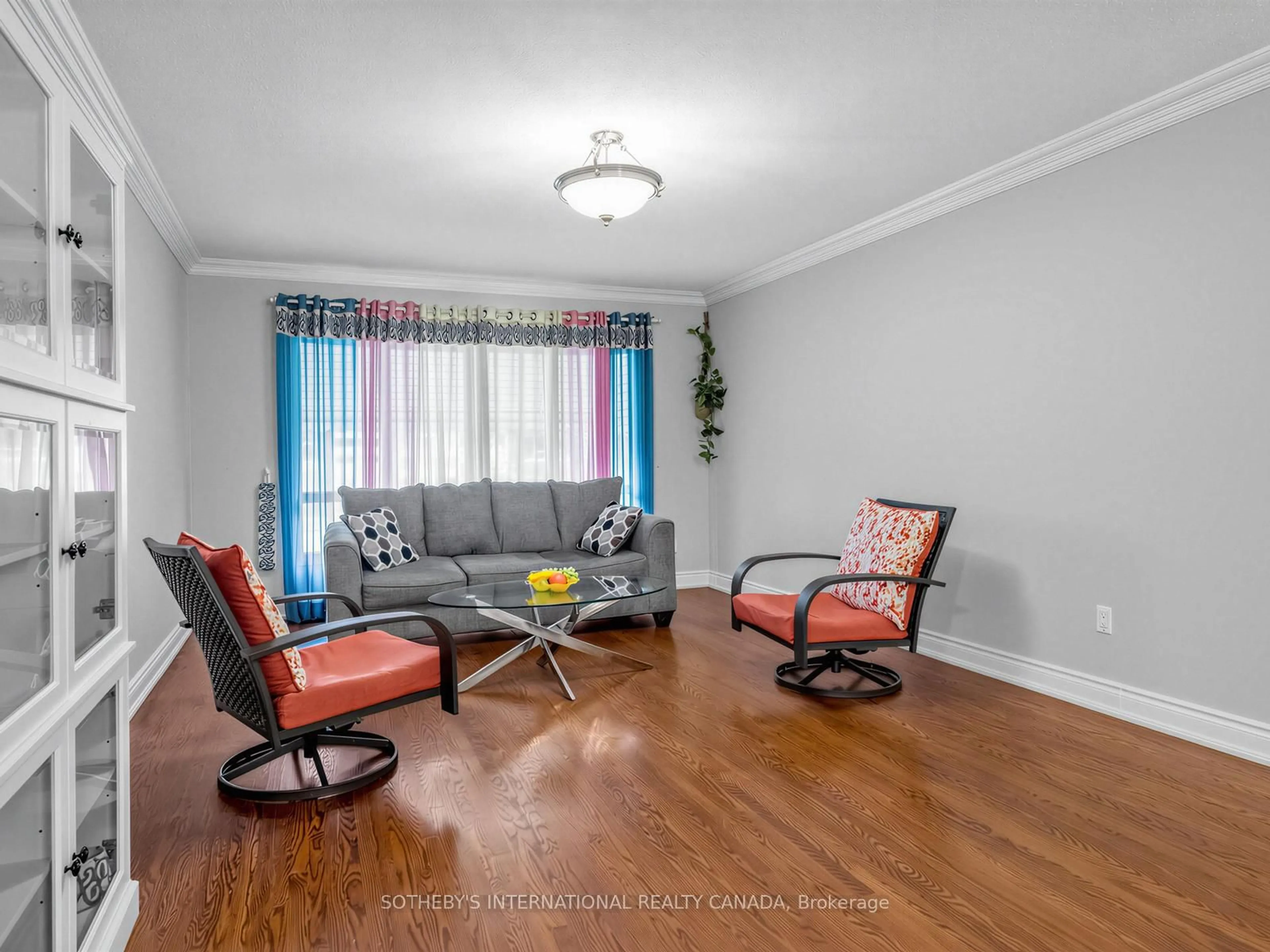 Living room with furniture, wood/laminate floor for 3352 Queen Frederica Dr, Mississauga Ontario L4Y 3B2