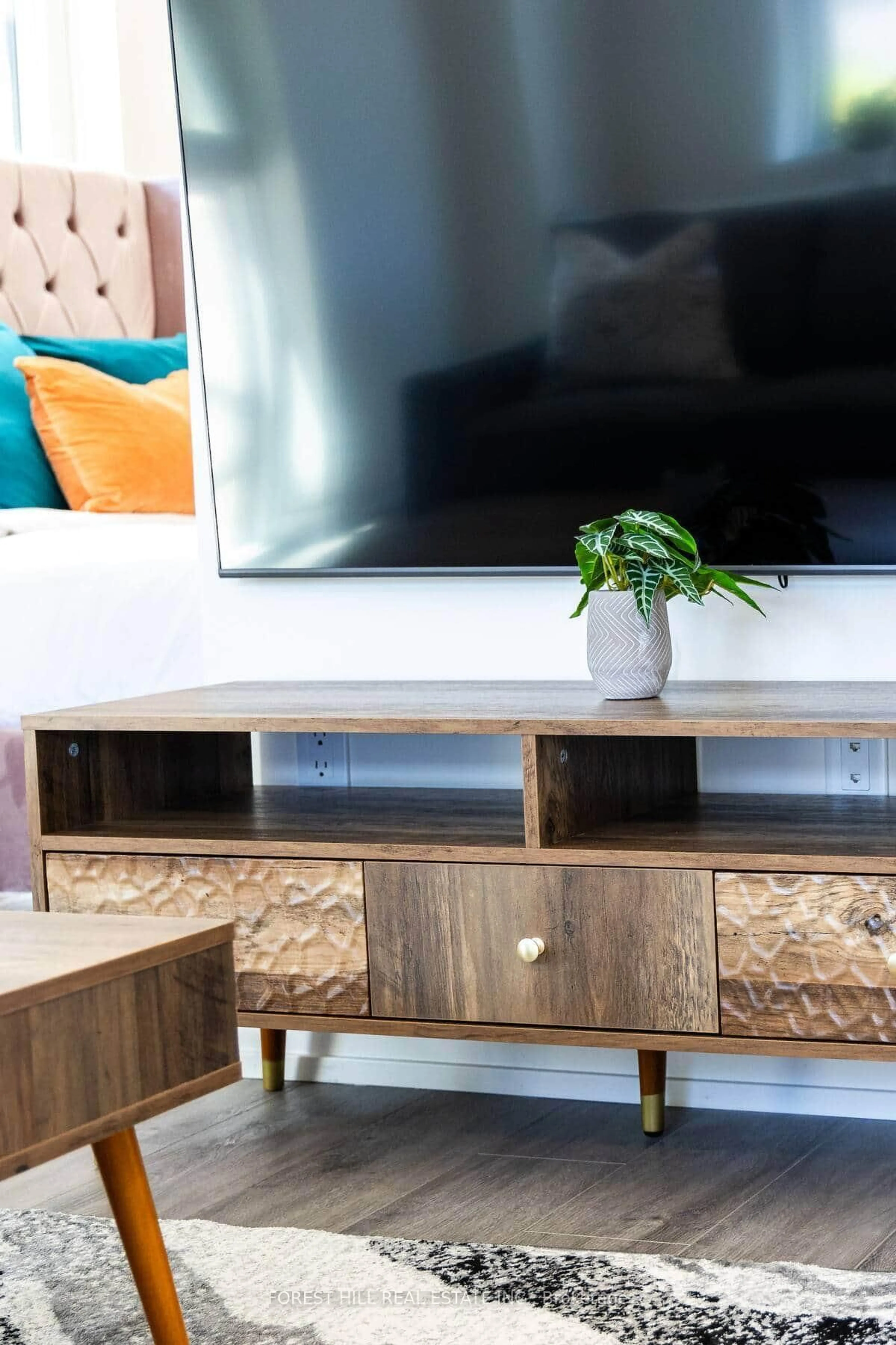 Living room with furniture, wood/laminate floor for 2300 St Clair Ave #101, Toronto Ontario M6N 0B3