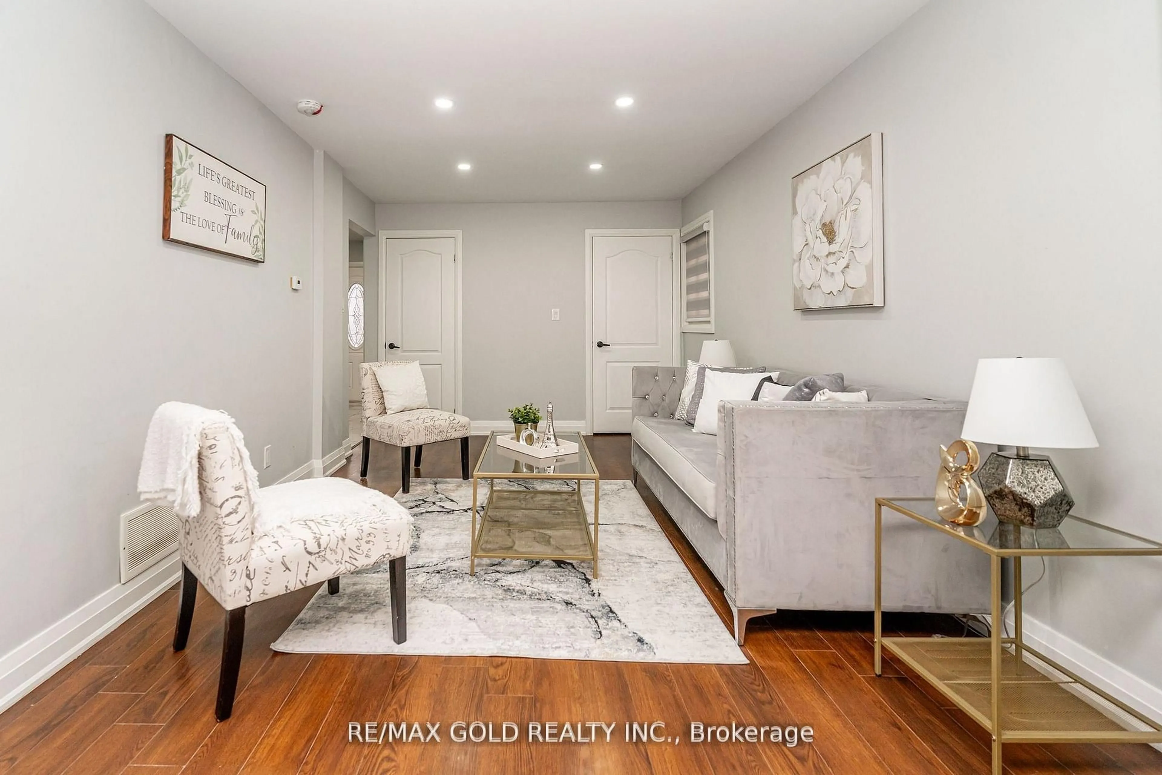 Living room with furniture, wood/laminate floor for 13 Martindale Cres, Brampton Ontario L6X 2V7