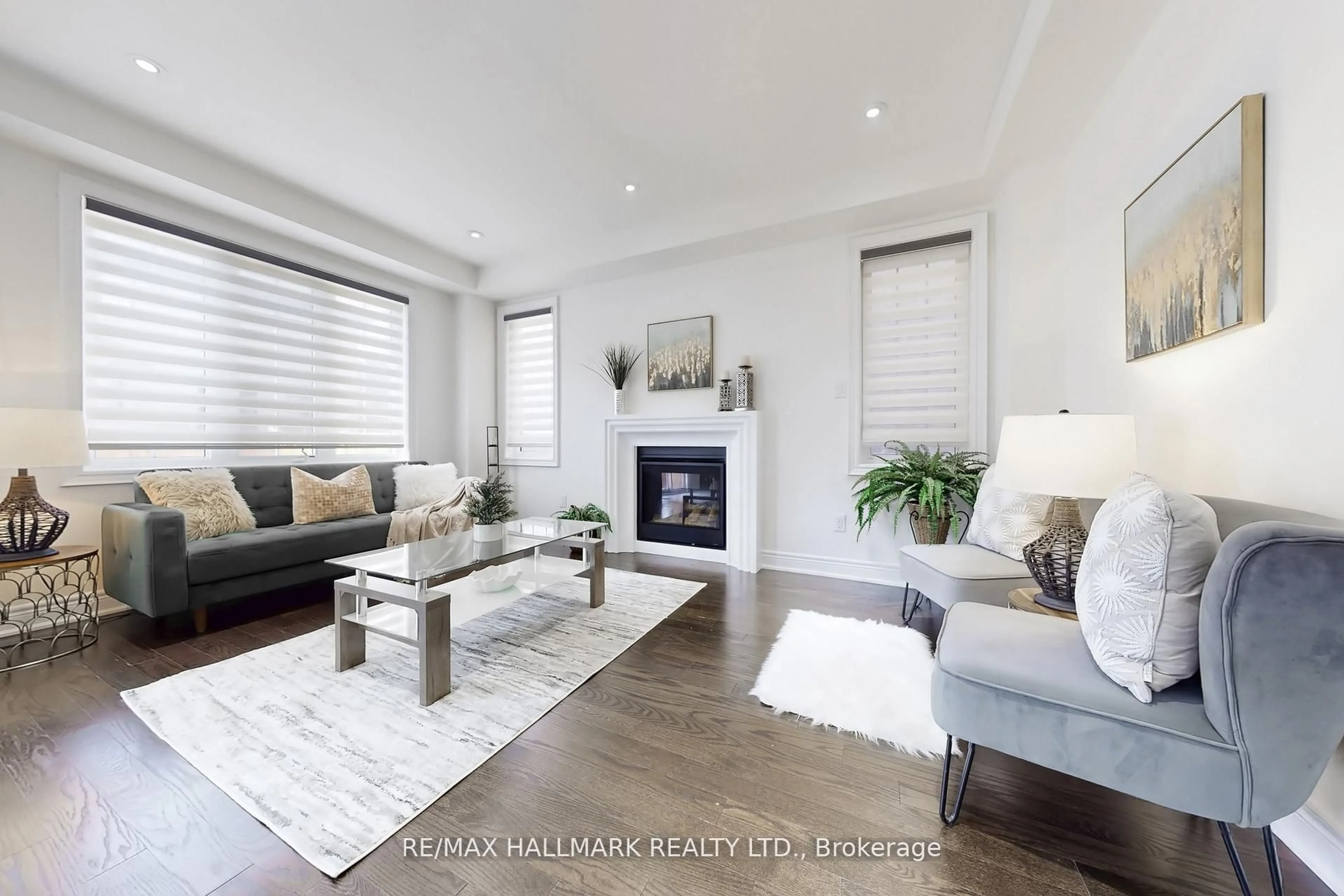 Living room with furniture, wood/laminate floor for 9 Lyle Way, Brampton Ontario L6X 5P8