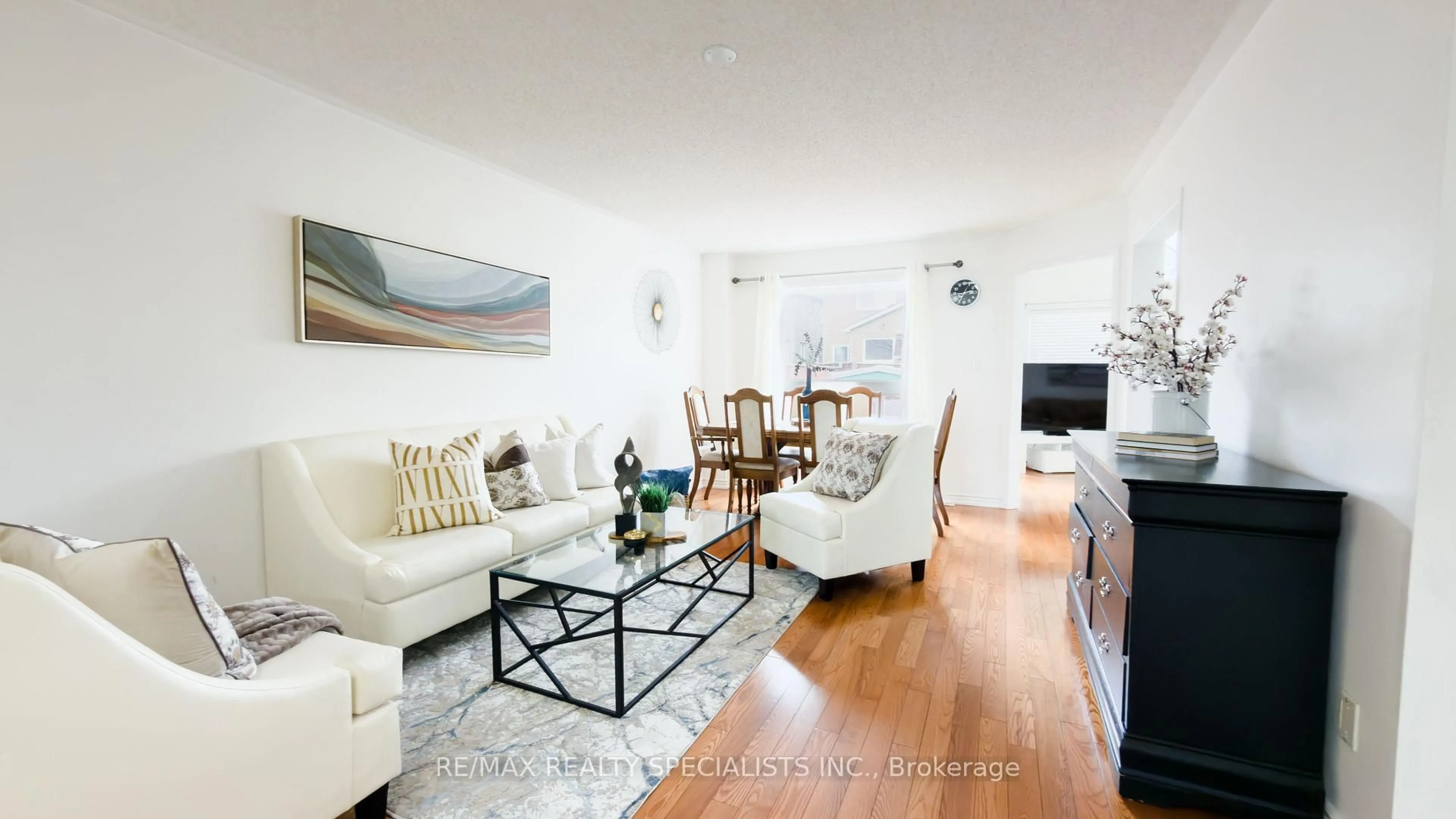 Living room with furniture, wood/laminate floor for 32 Feather Reed Way, Brampton Ontario L6R 3A3