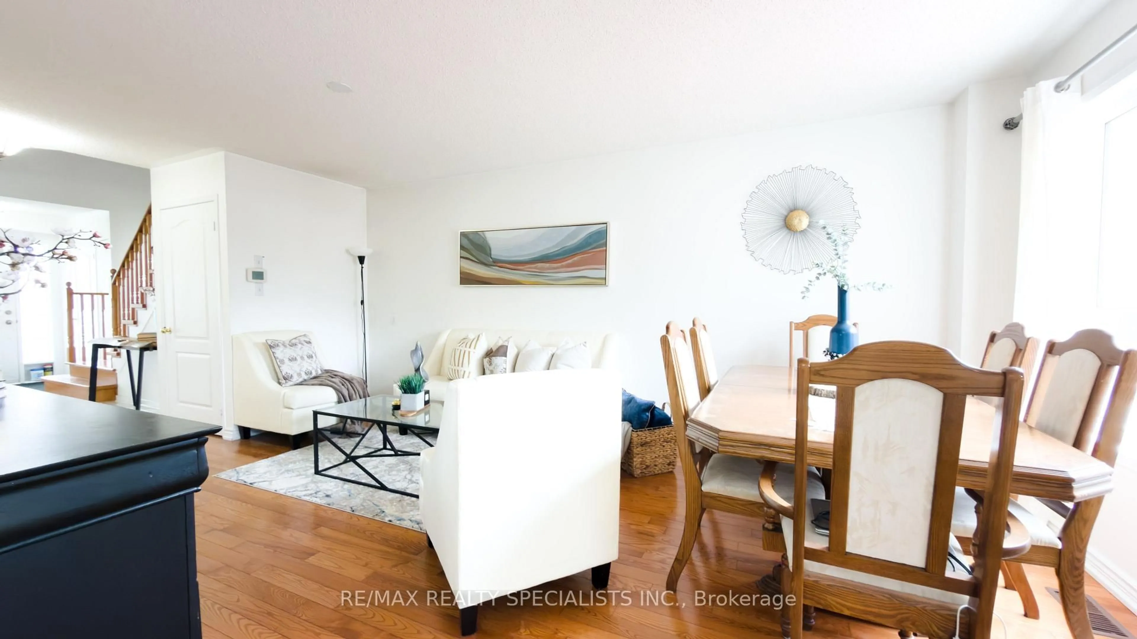 Living room with furniture, wood/laminate floor for 32 Feather Reed Way, Brampton Ontario L6R 3A3