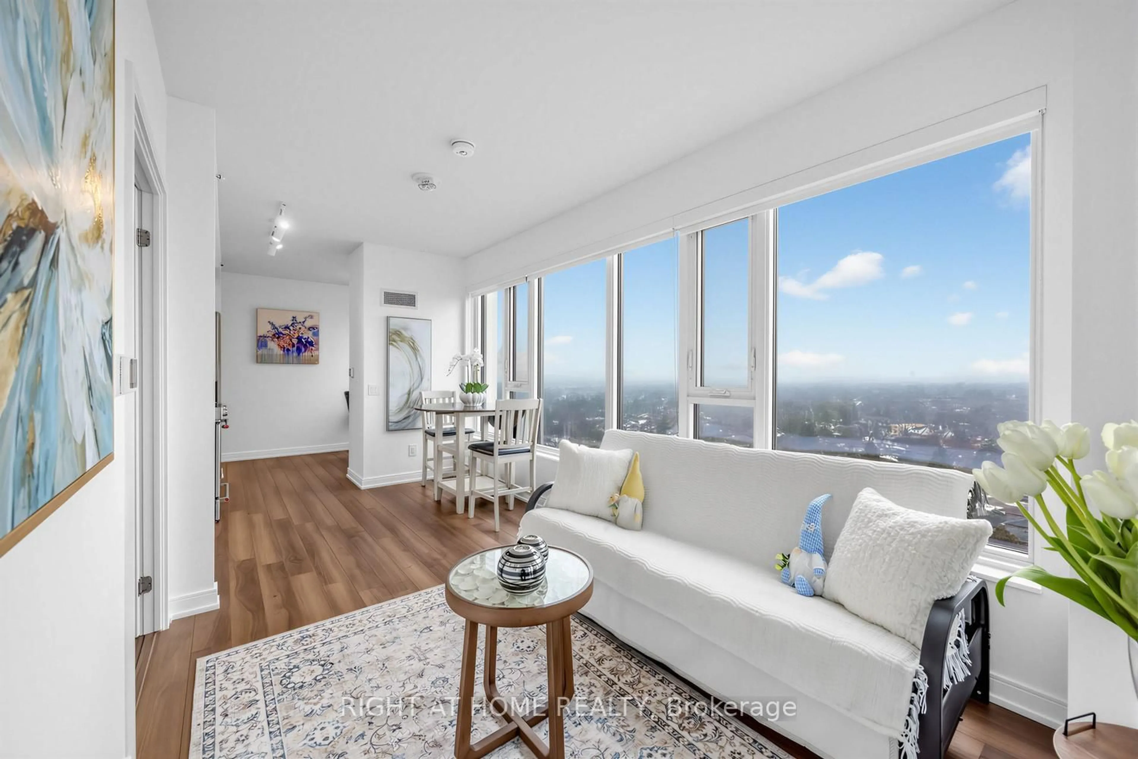 Living room with furniture, wood/laminate floor for 30 Samuel Wood Way #1404, Toronto Ontario M9B 0C9