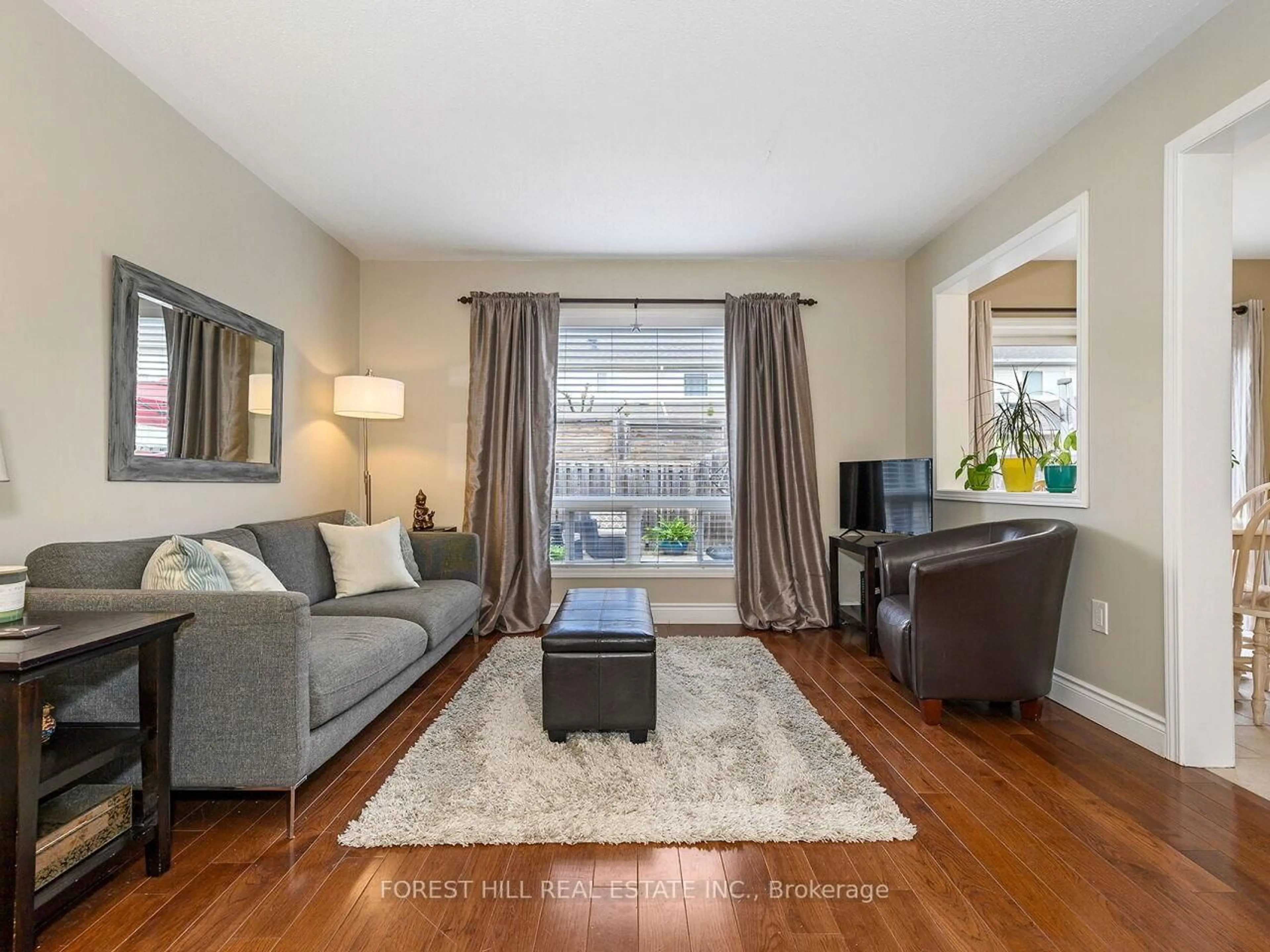Living room with furniture, wood/laminate floor for 1066 Cooper Ave, Milton Ontario L9T 5W6