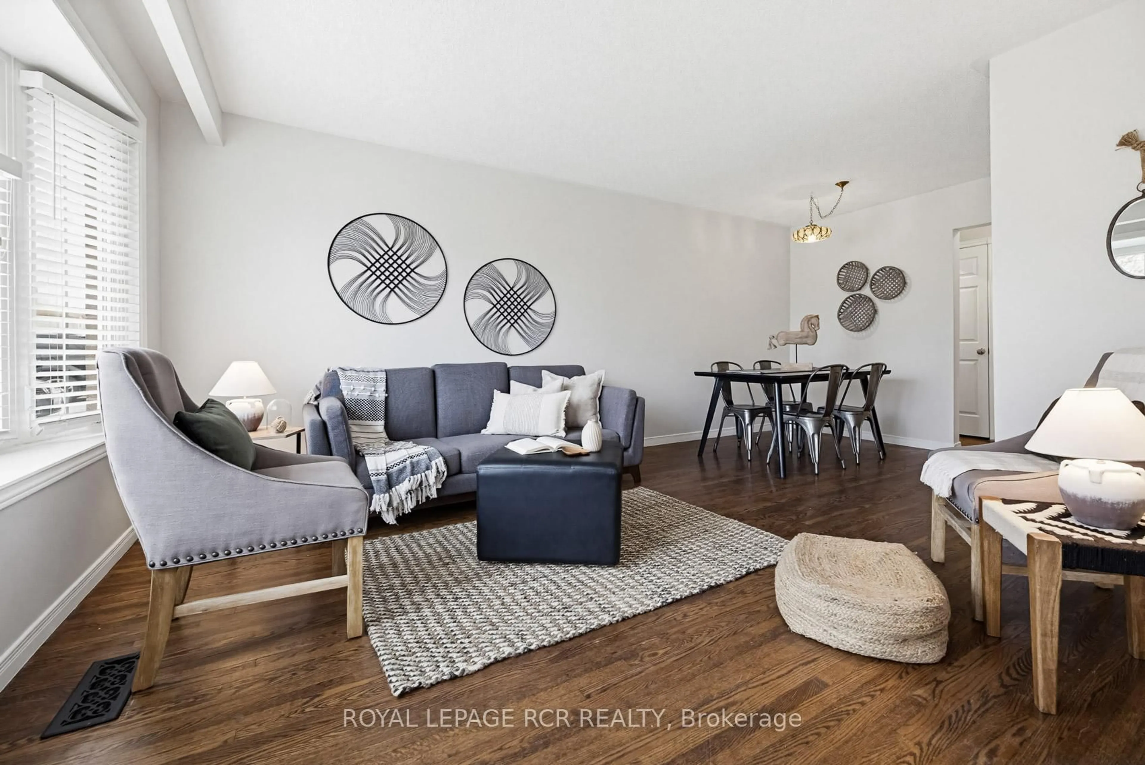 Living room with furniture, wood/laminate floor for 17 Edelwild Dr, Orangeville Ontario L9W 2Y4