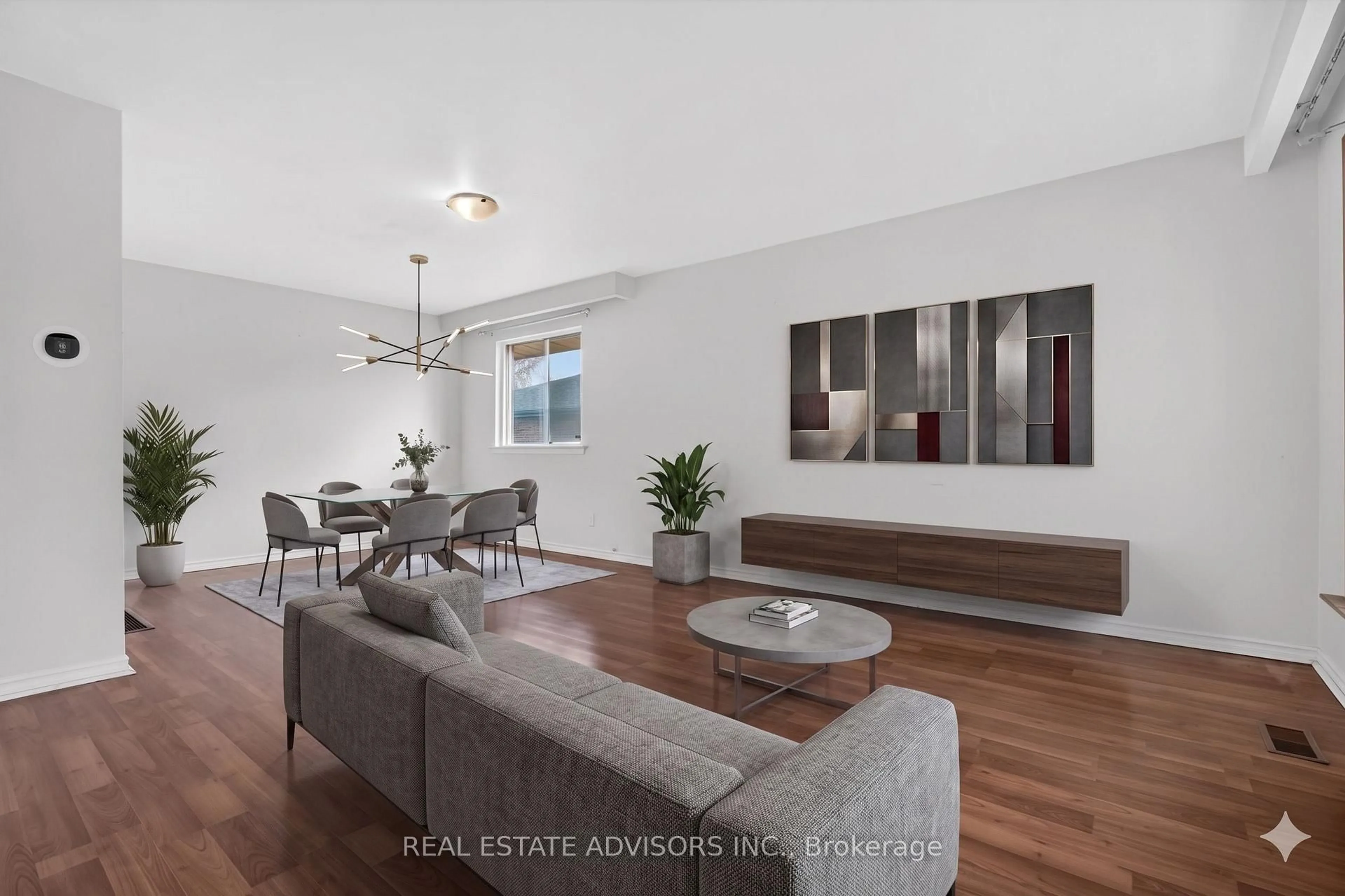 Living room with furniture, wood/laminate floor for 84 Ardglen Dr, Brampton Ontario L6W 1V6