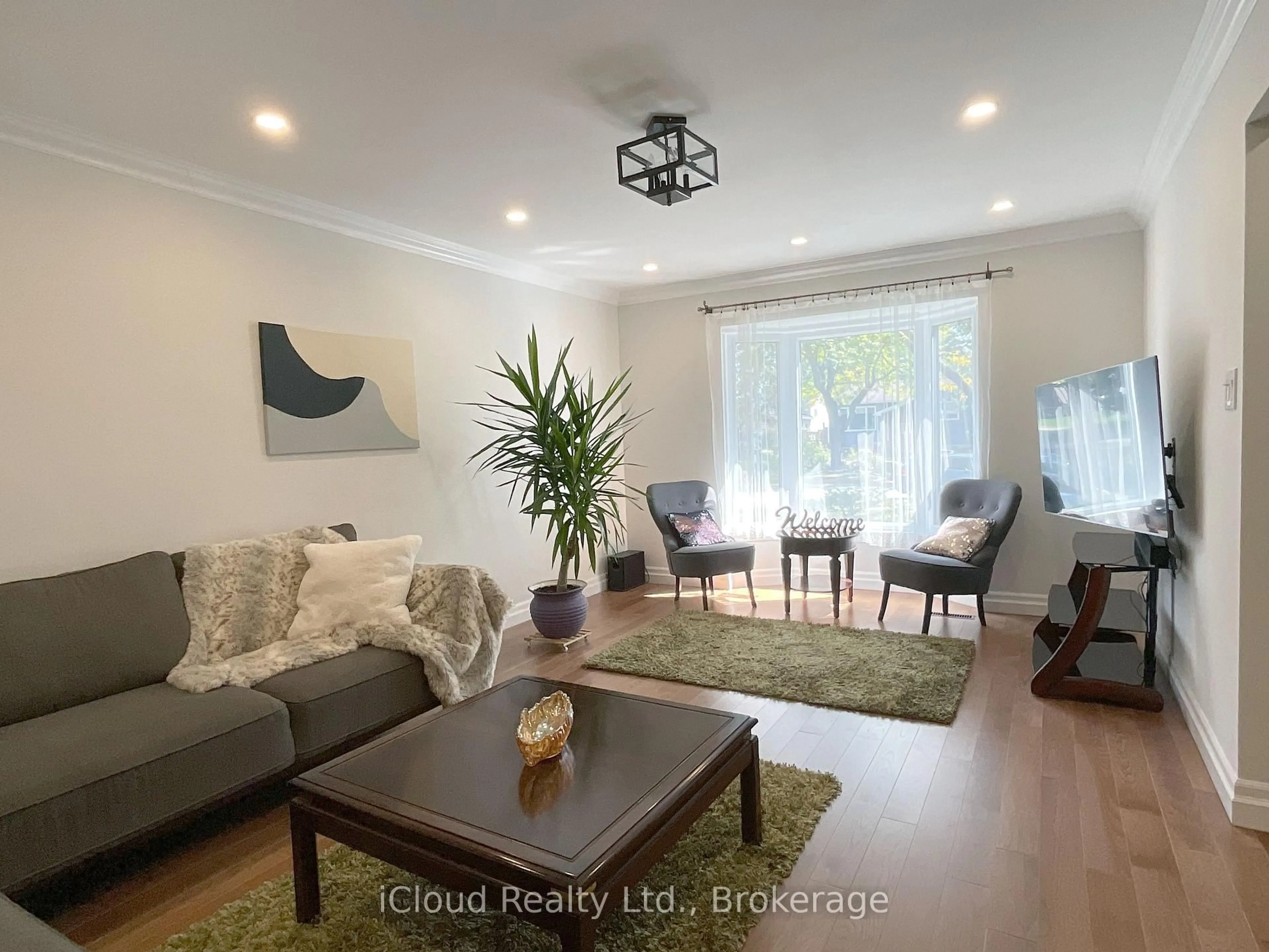 Living room with furniture, wood/laminate floor for 73 Wright Cres, Caledon Ontario L7E 3X6