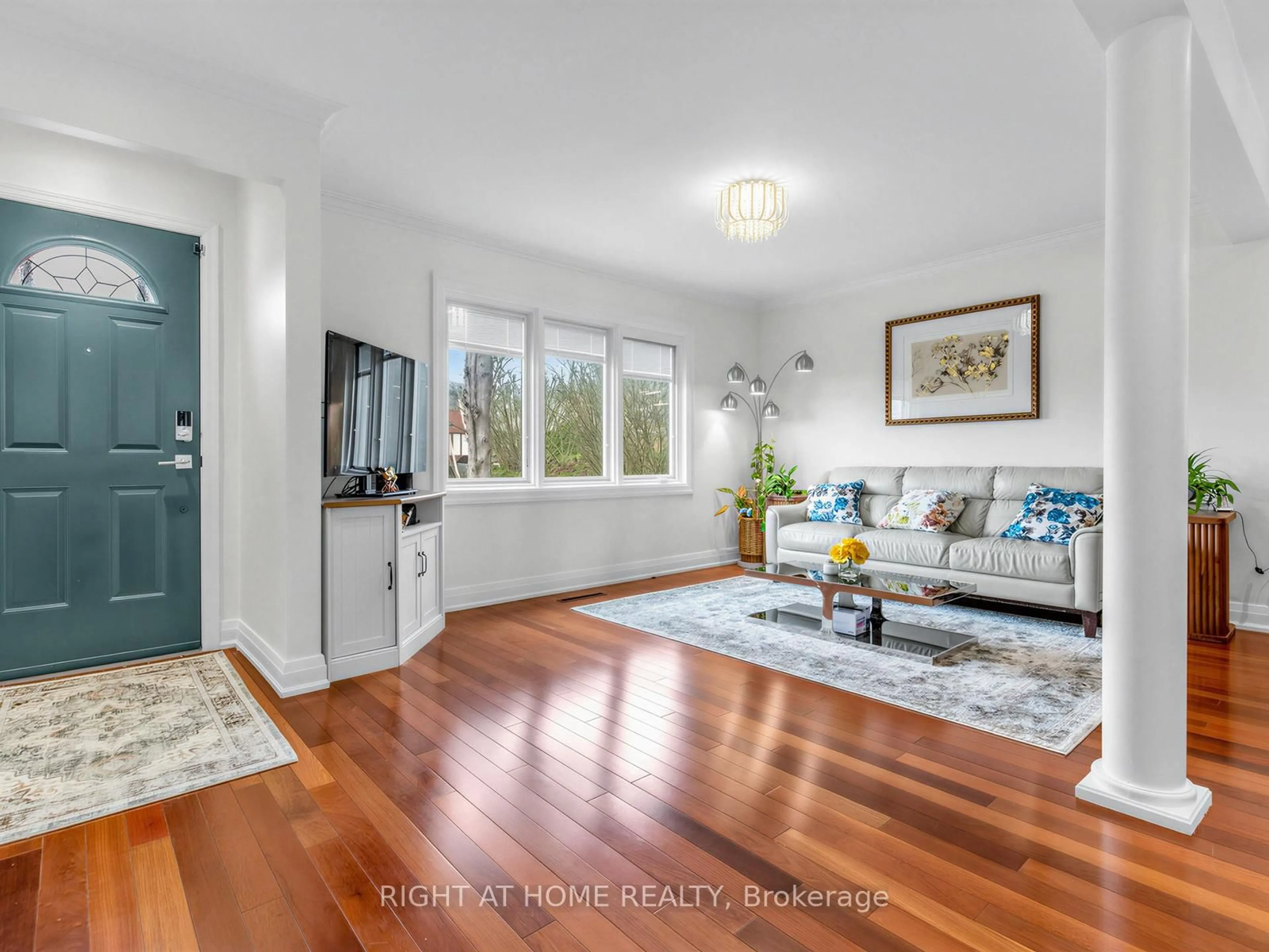 Living room with furniture, wood/laminate floor for 85 Flamborough Dr, Toronto Ontario M6M 2R8