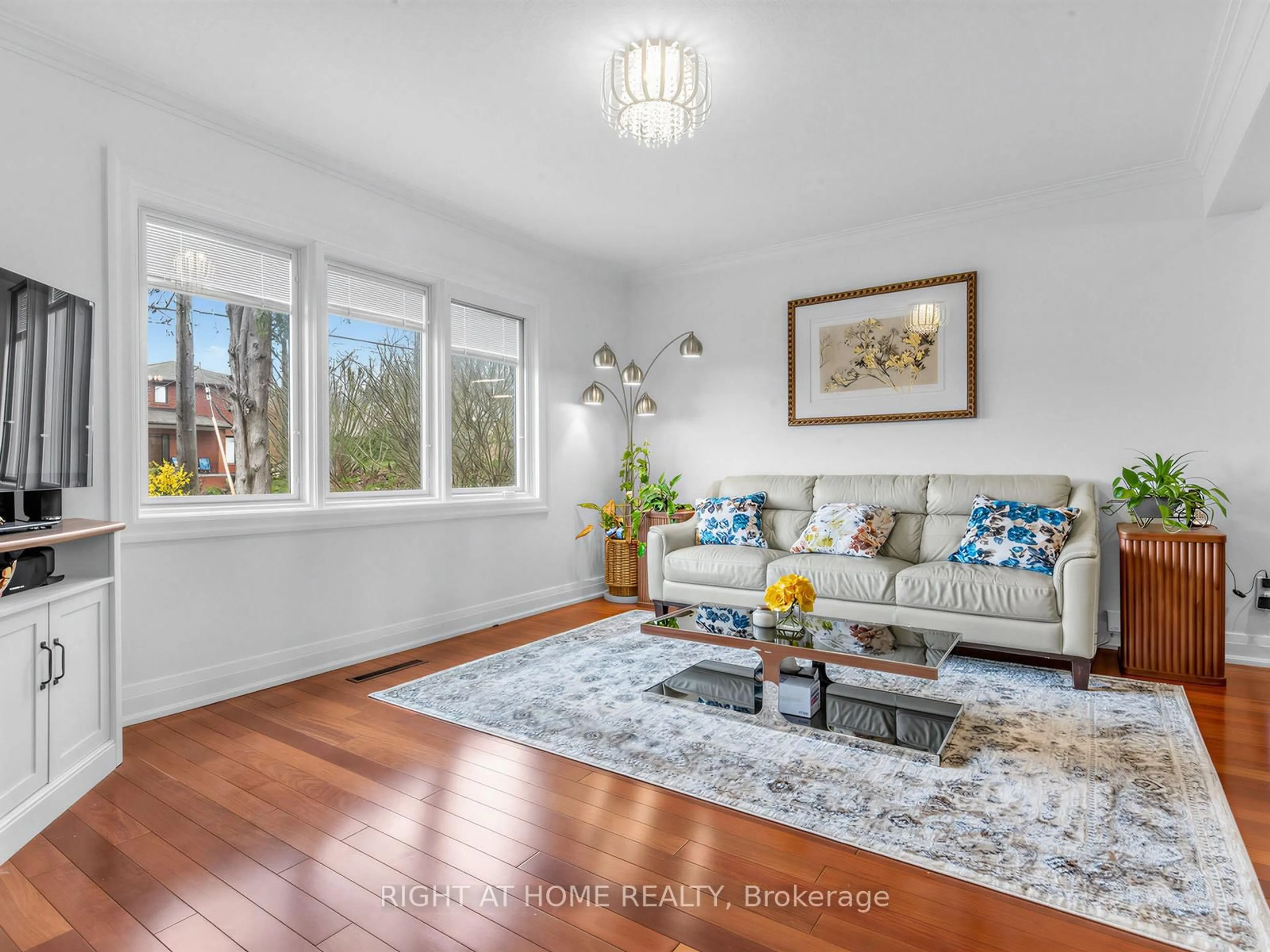 Living room with furniture, wood/laminate floor for 85 Flamborough Dr, Toronto Ontario M6M 2R8
