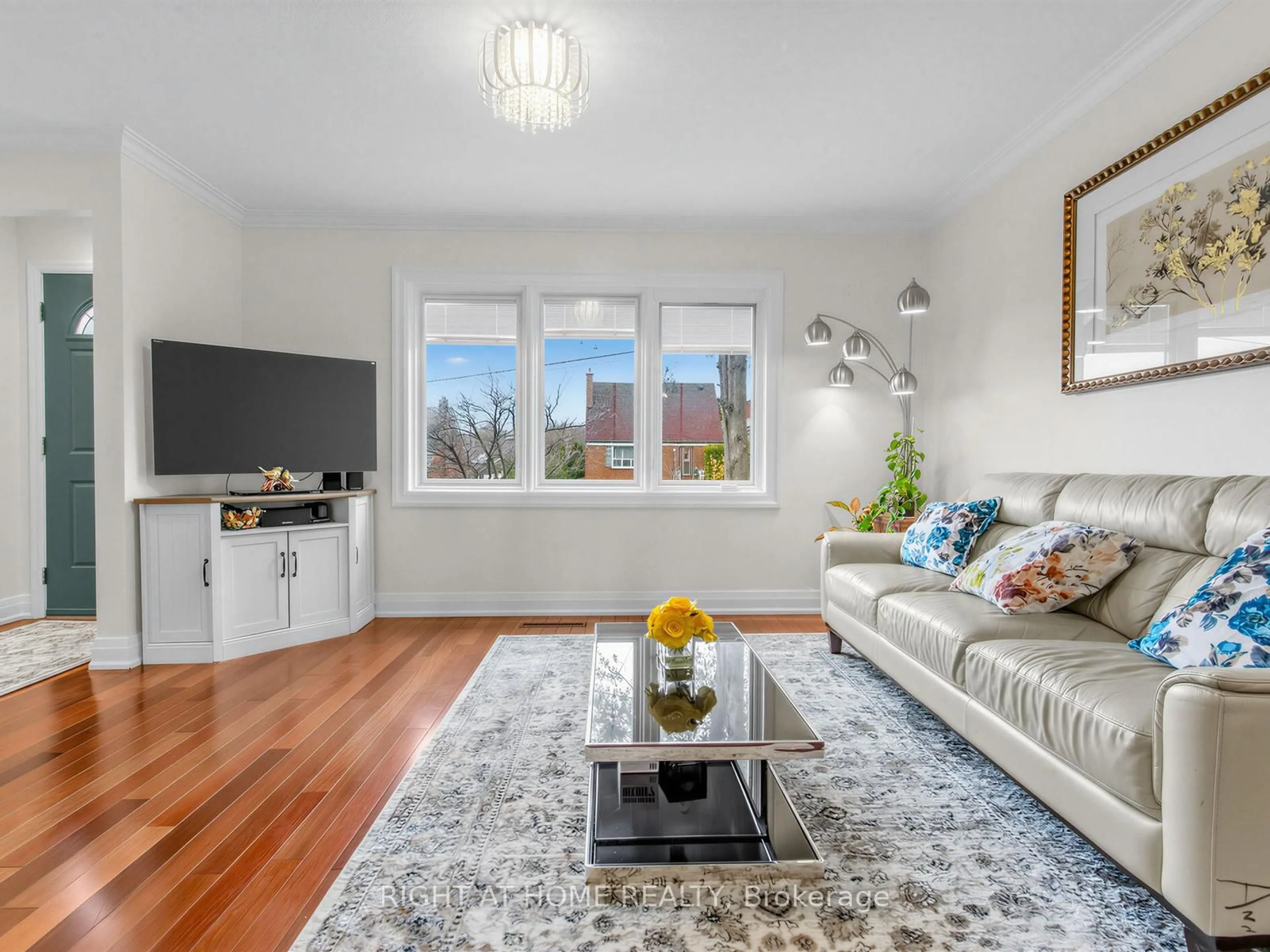 Living room with furniture, wood/laminate floor for 85 Flamborough Dr, Toronto Ontario M6M 2R8