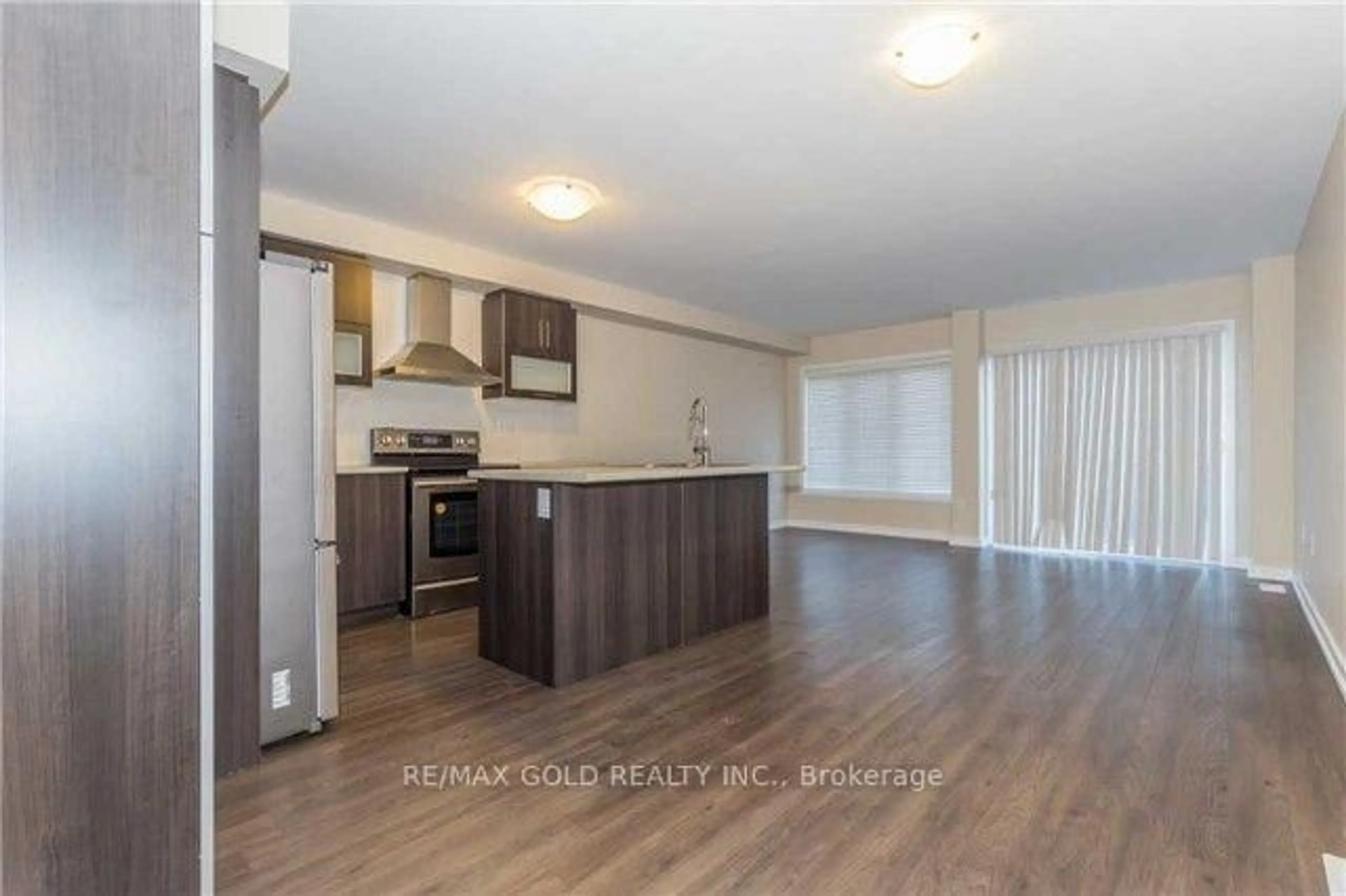 Open concept kitchen, wood/laminate floor for 22 clinton St, Brampton Ontario L7A 4K8