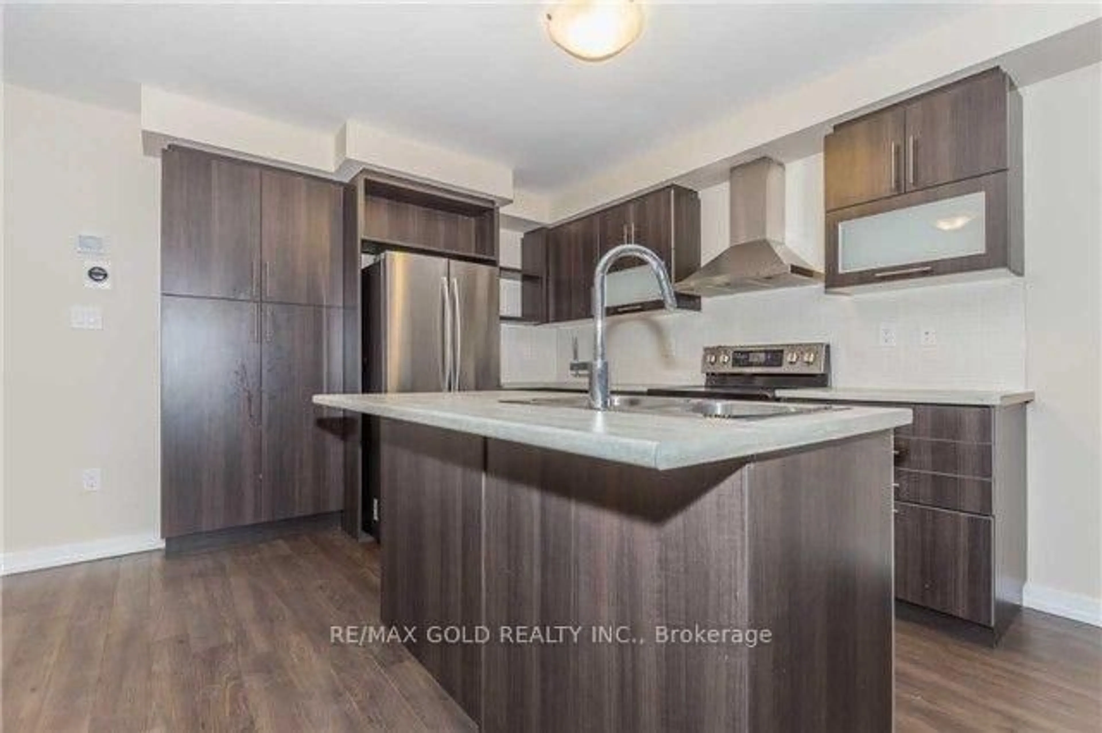 Open concept kitchen, wood/laminate floor for 22 clinton St, Brampton Ontario L7A 4K8