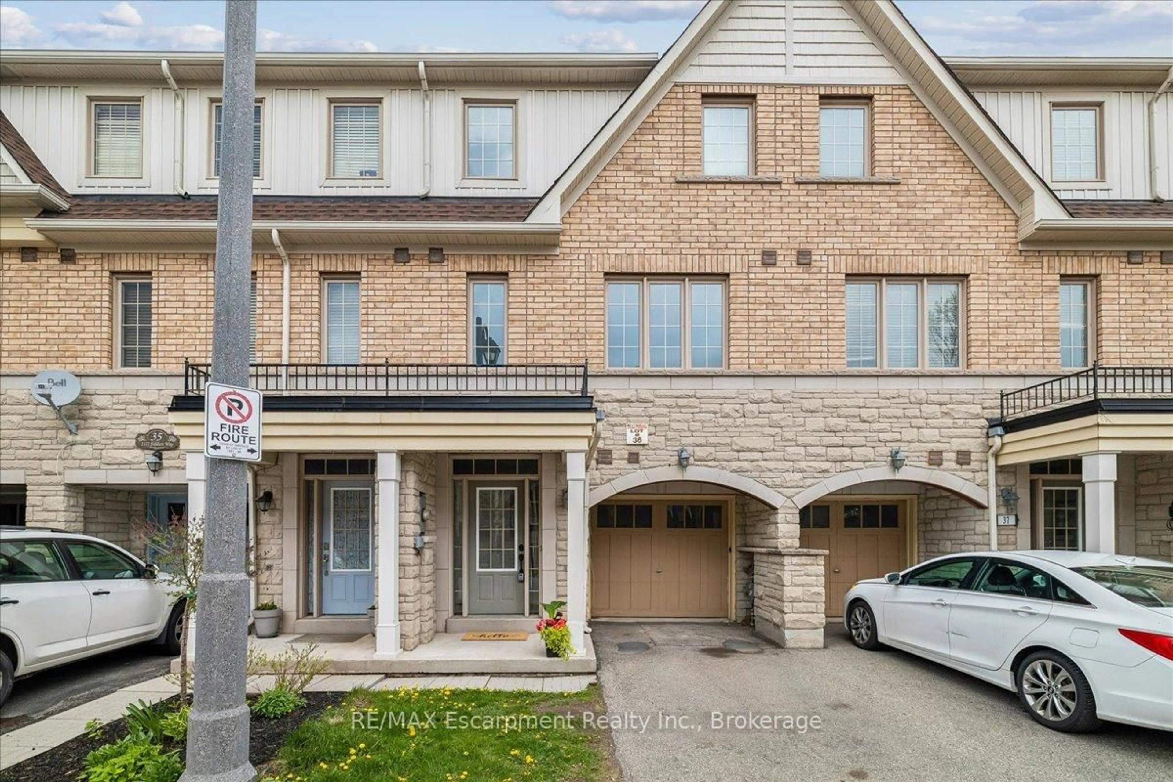 Home with brick exterior material, street for 2171 Fiddlers Way #36, Oakville Ontario L6M 0R9