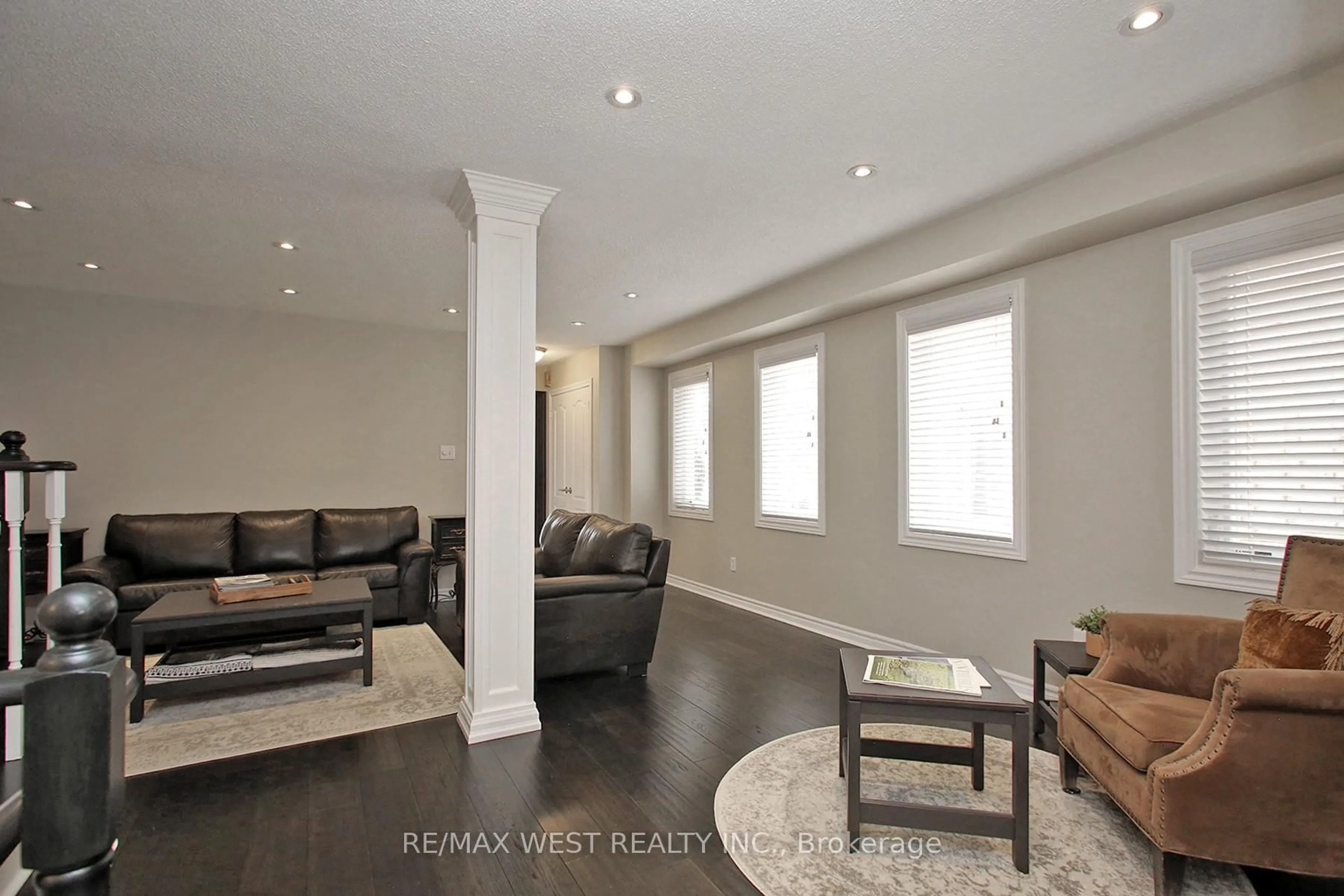 Living room with furniture, wood/laminate floor for 115 Grapevine Rd, Caledon Ontario L7E 2M6