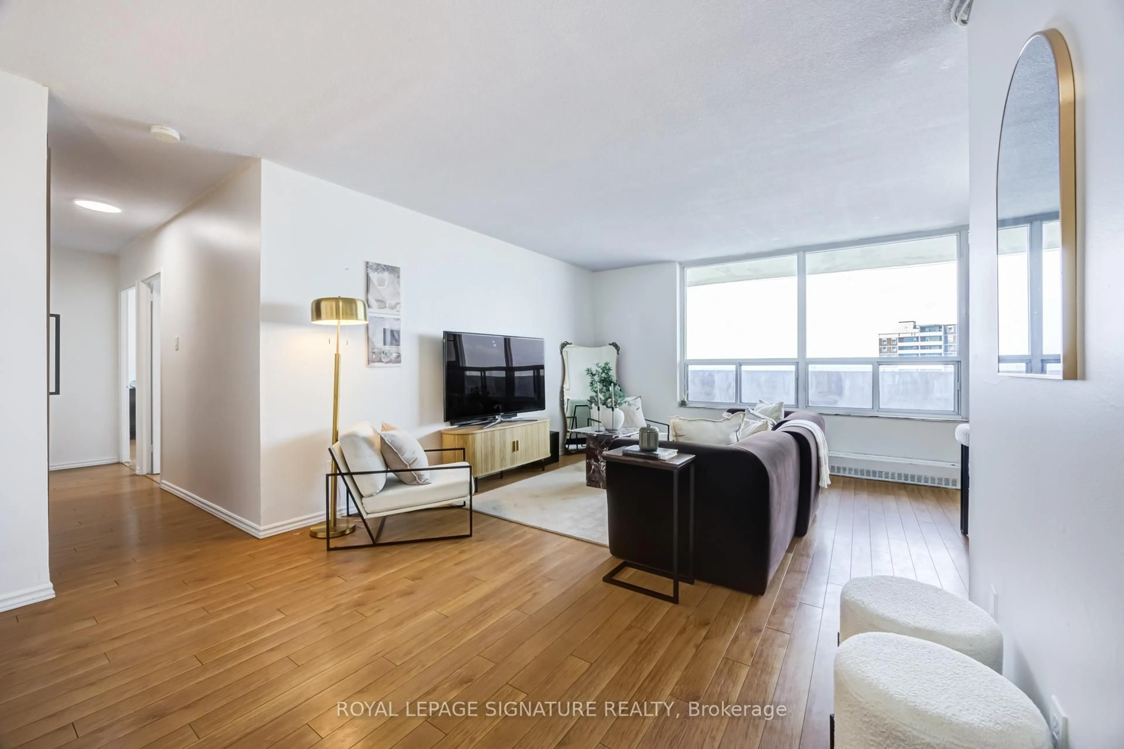 Living room with furniture, wood/laminate floor for 3390 Weston Rd #2309, Toronto Ontario M9M 2X3